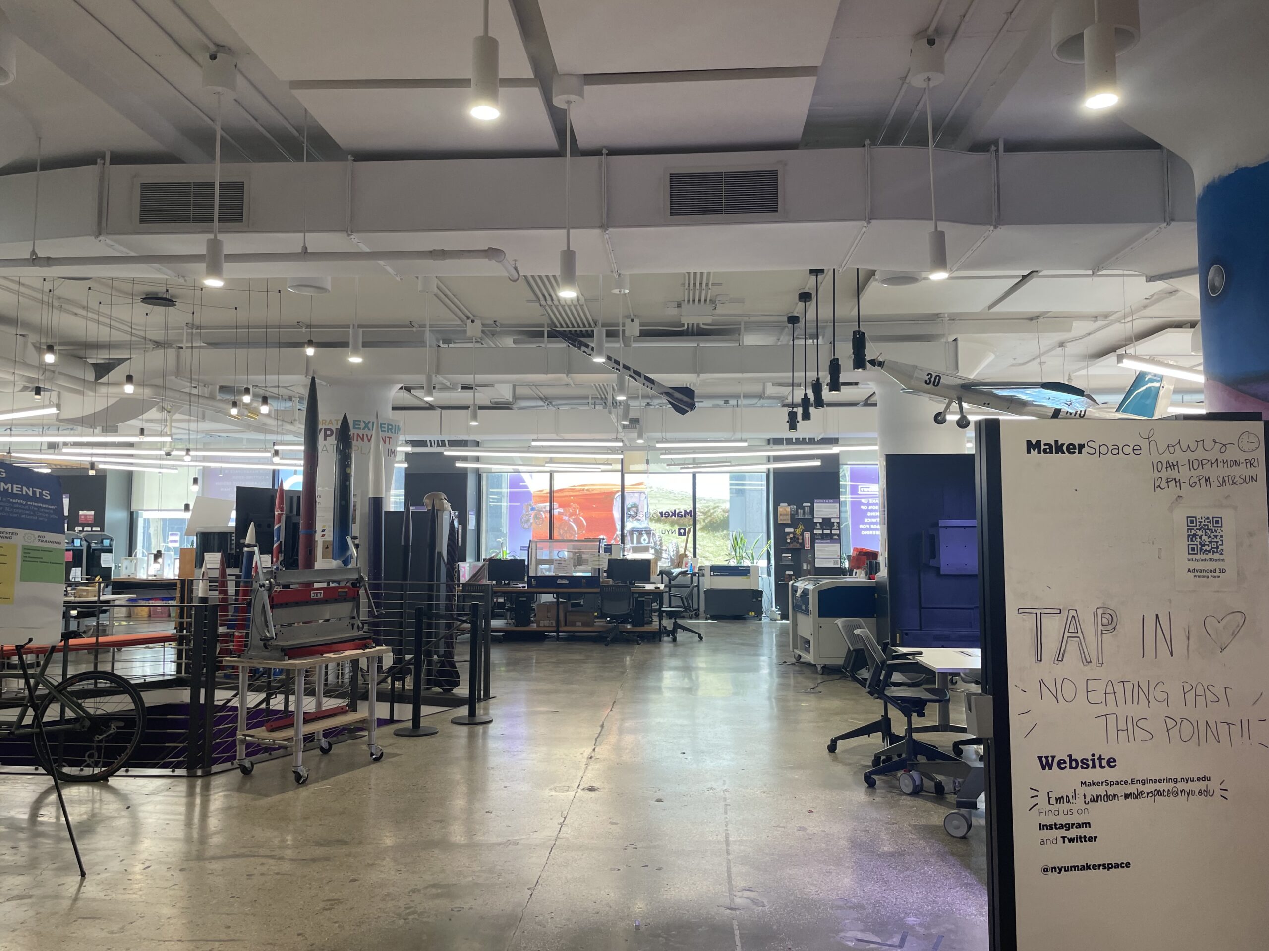The entrance of the NYU MakerSpace, where there are many machines.