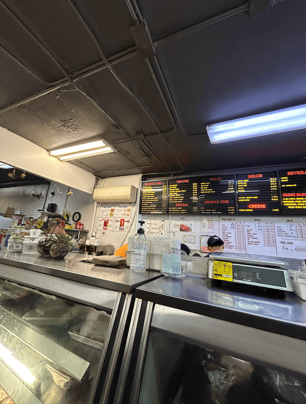 The bagel counter and menu board at Absolute Bagels in New York City’s Upper West Side.