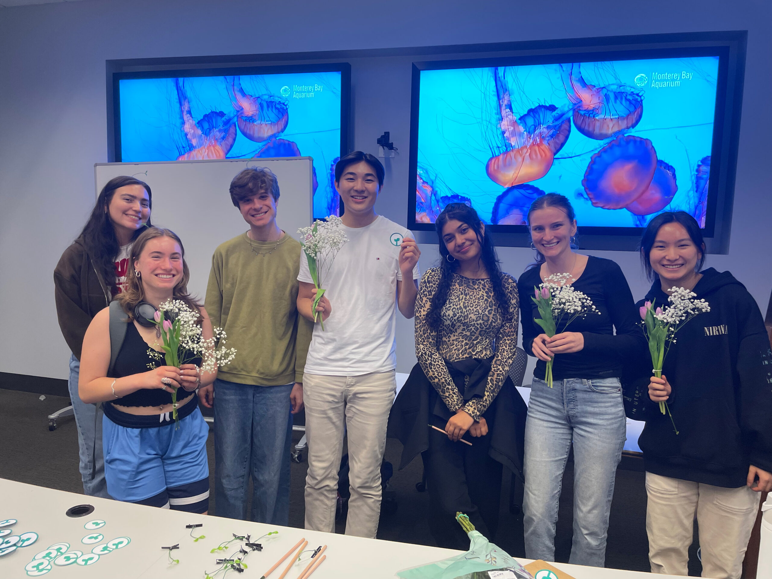 A group of students holding up their DIY bouquets.