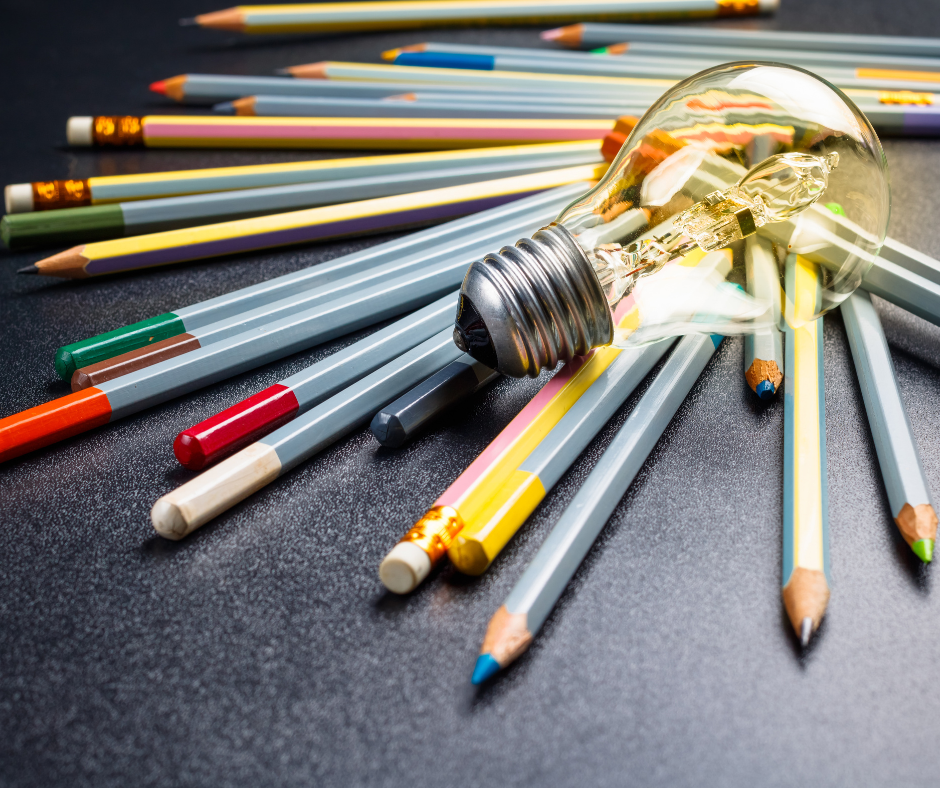 photo of pencils with a lightbulb on top