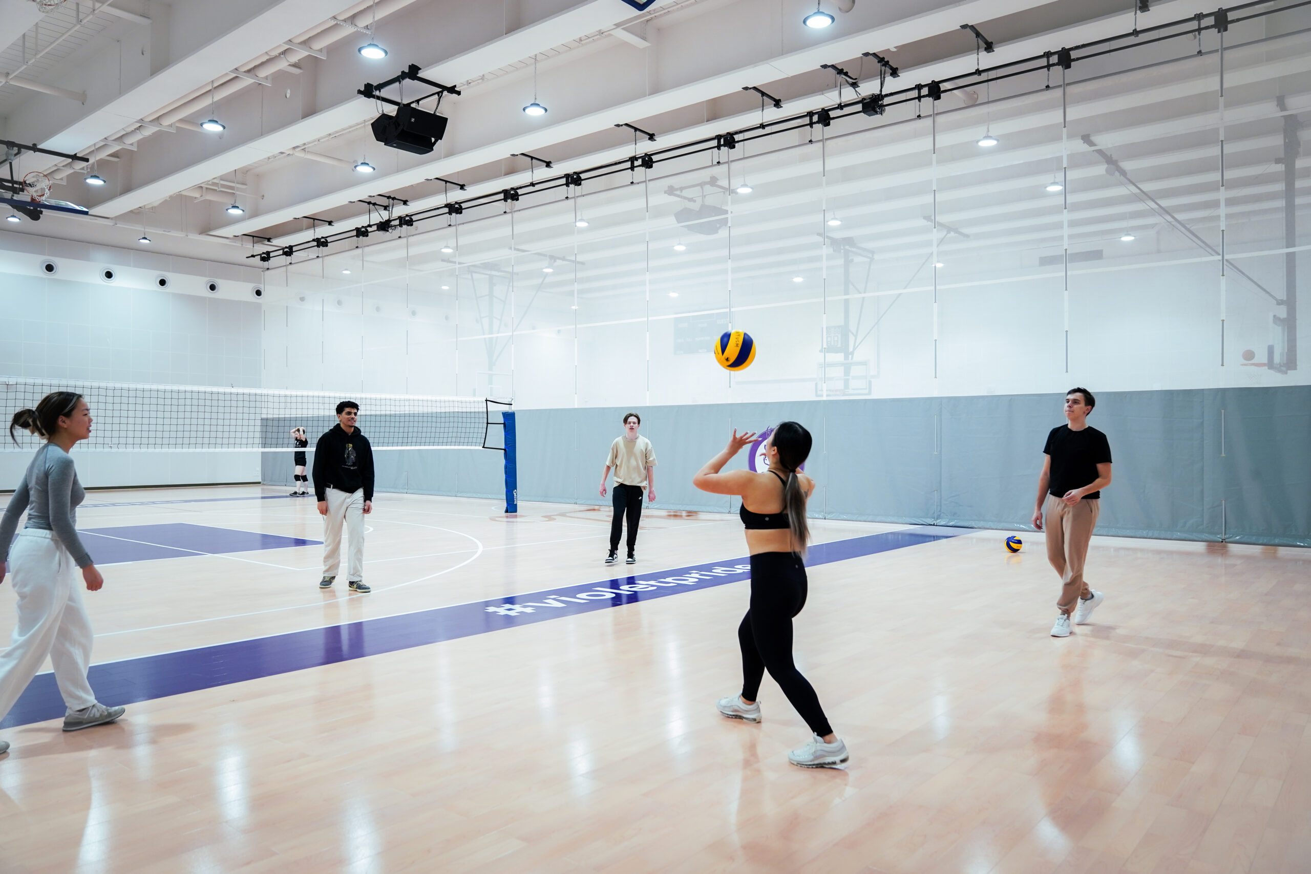 students playing volleyball