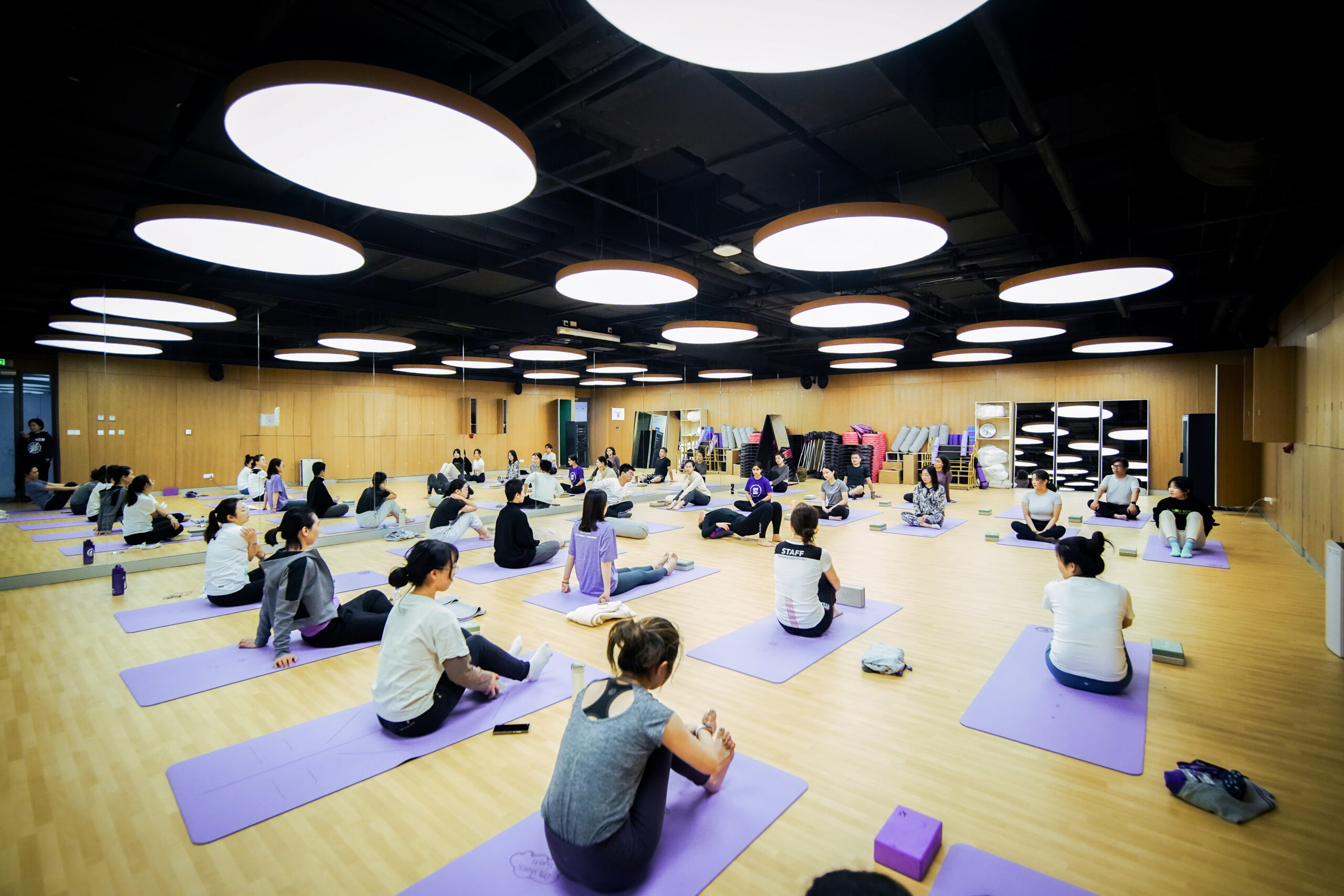 A group of students practice yoga