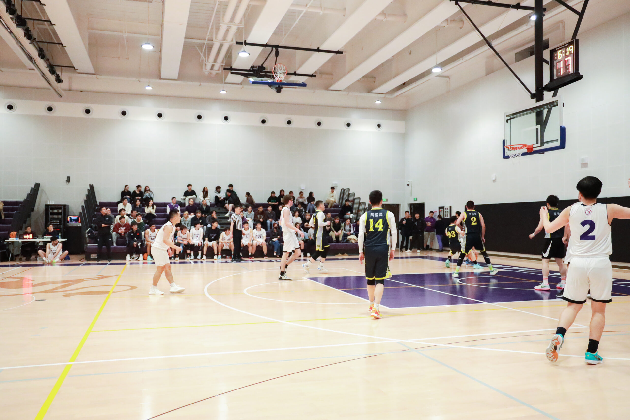 a basketball game in the NYUSH athletics center