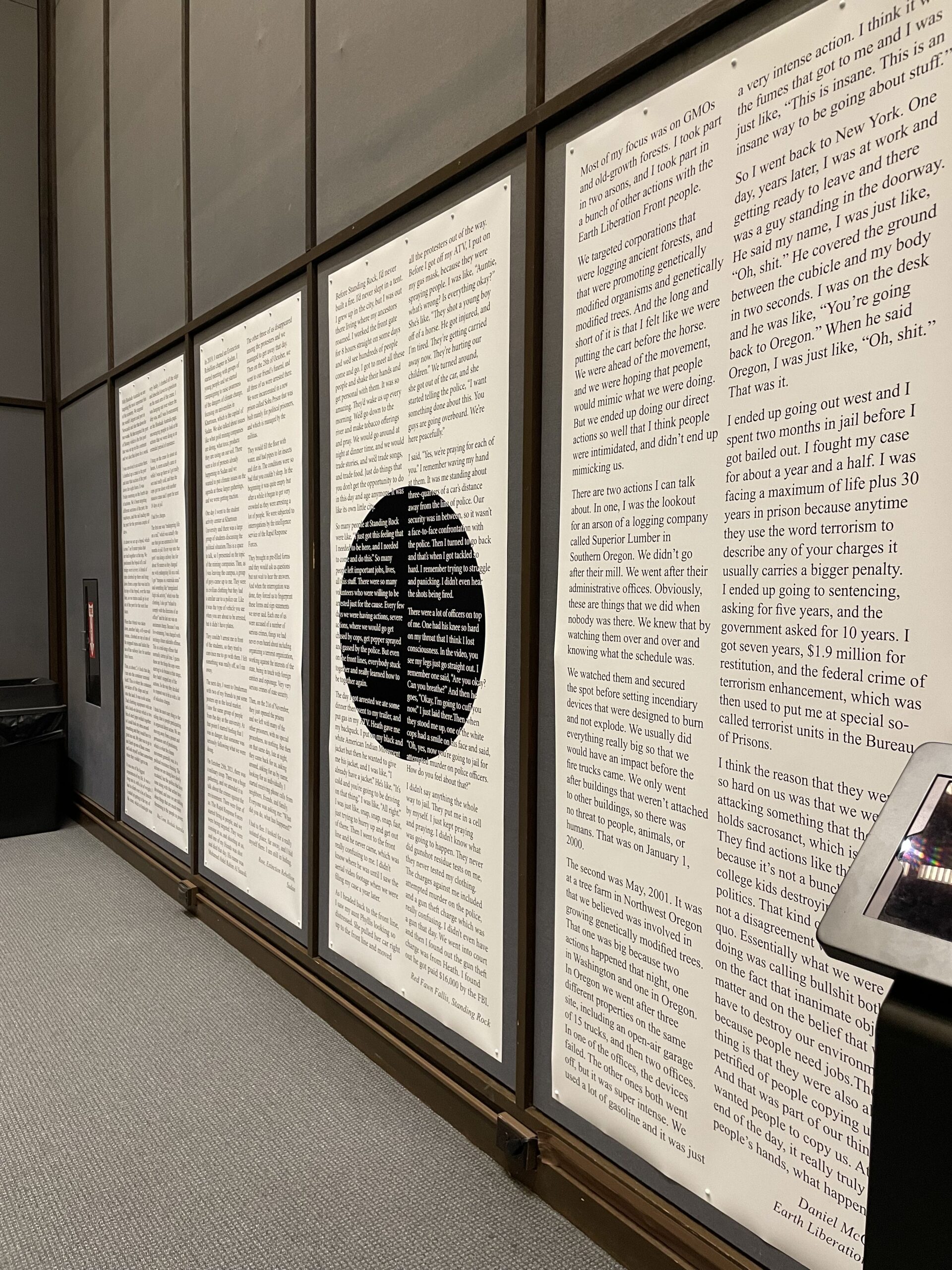 Large posters of text in a library exhibition.