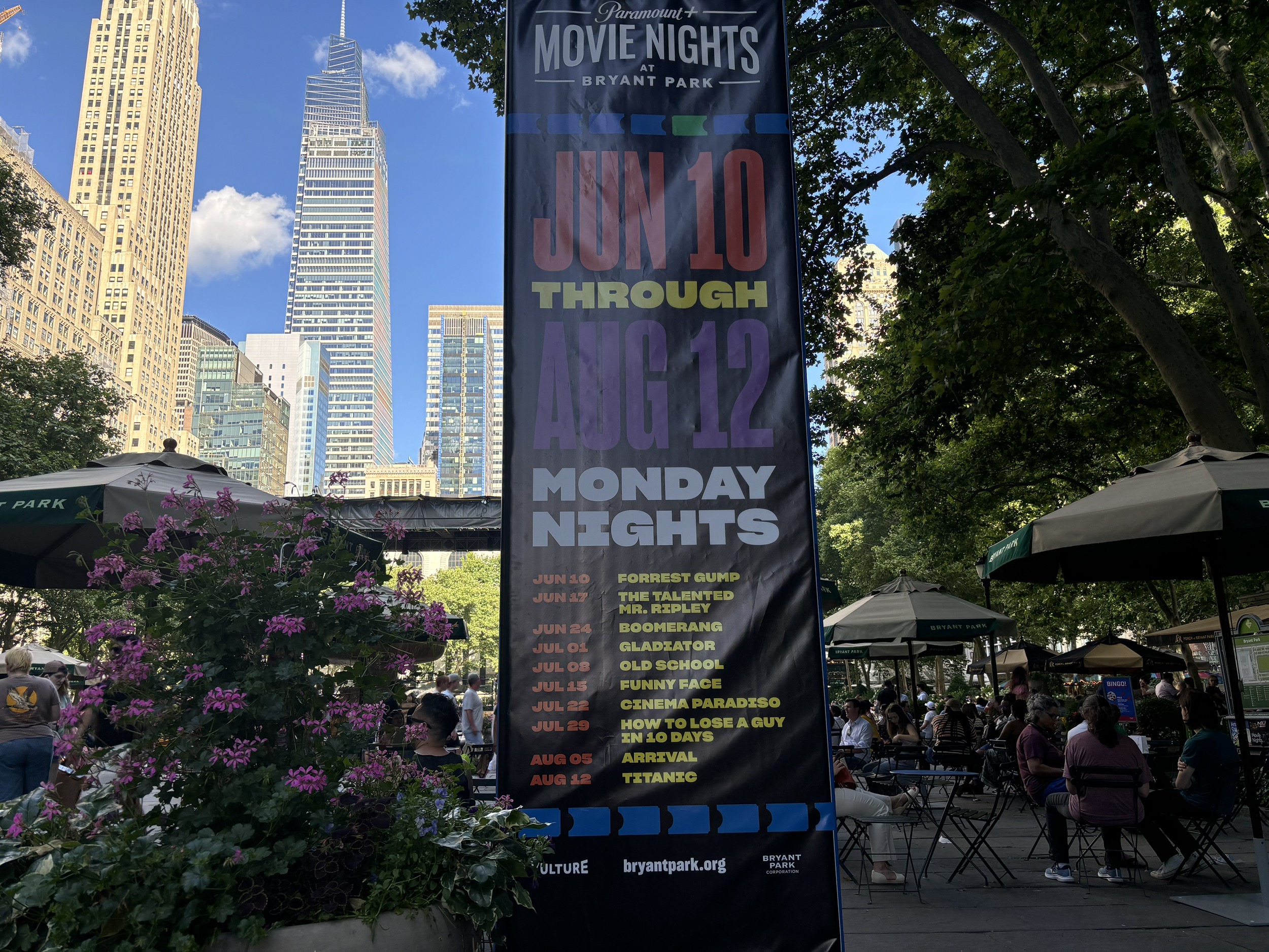 A picture of a poster for Movie Nights at Bryant Park. The lineup includes Forrest Gump, The Talented Mr. Ripley, Boomerang, Gladiator, Old School, Funny Face, Cinema Paradiso, How to Lose a Guy in 10 Days, Arrival, and Titanic