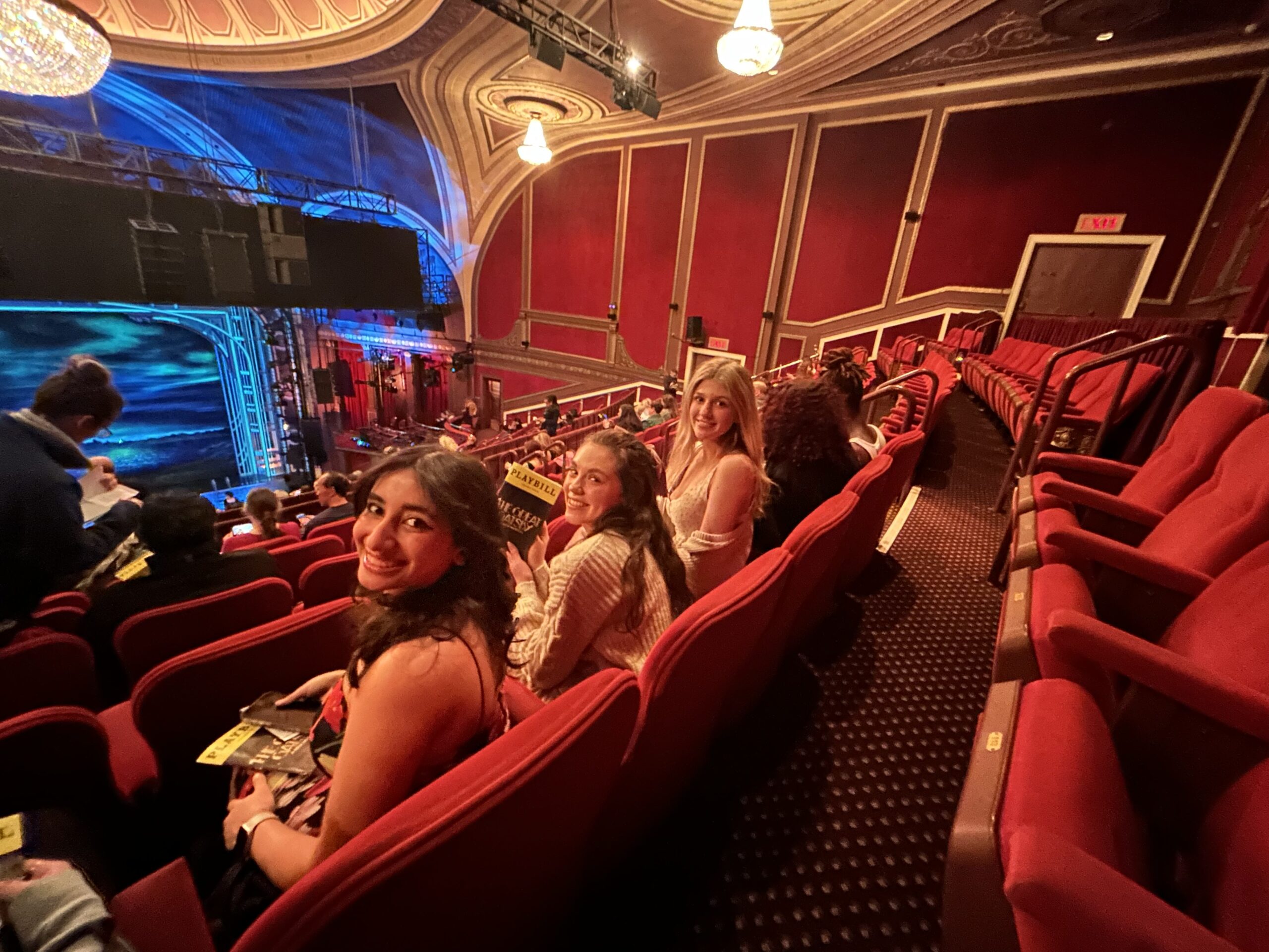 Another row of students in the theatre of a Broadway show.