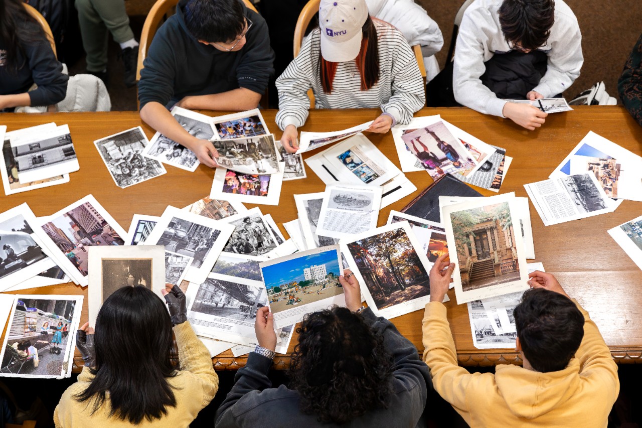 NYU students look at images from the NYPL Picture Collection.