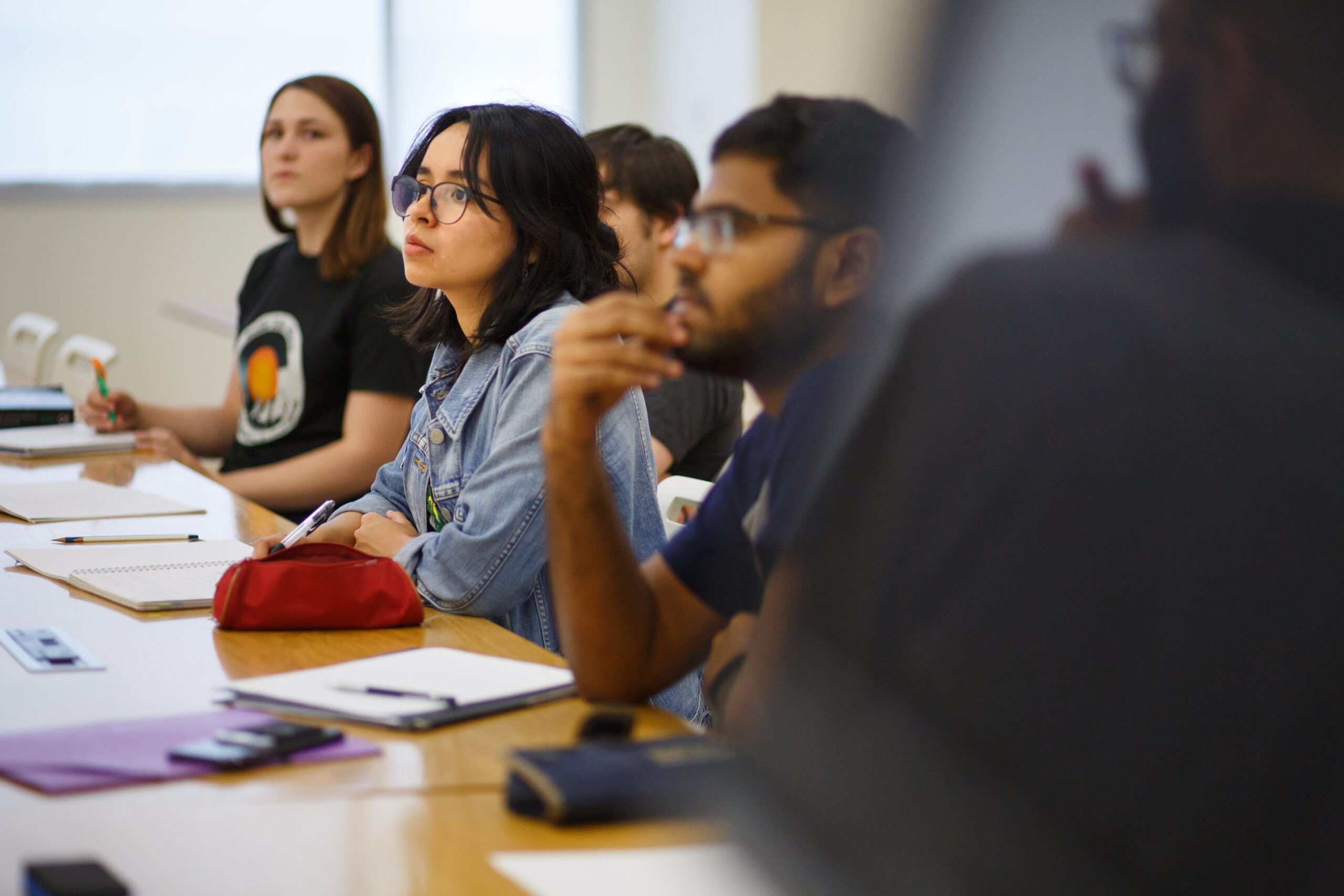 Students are seated and listening to a lecture.