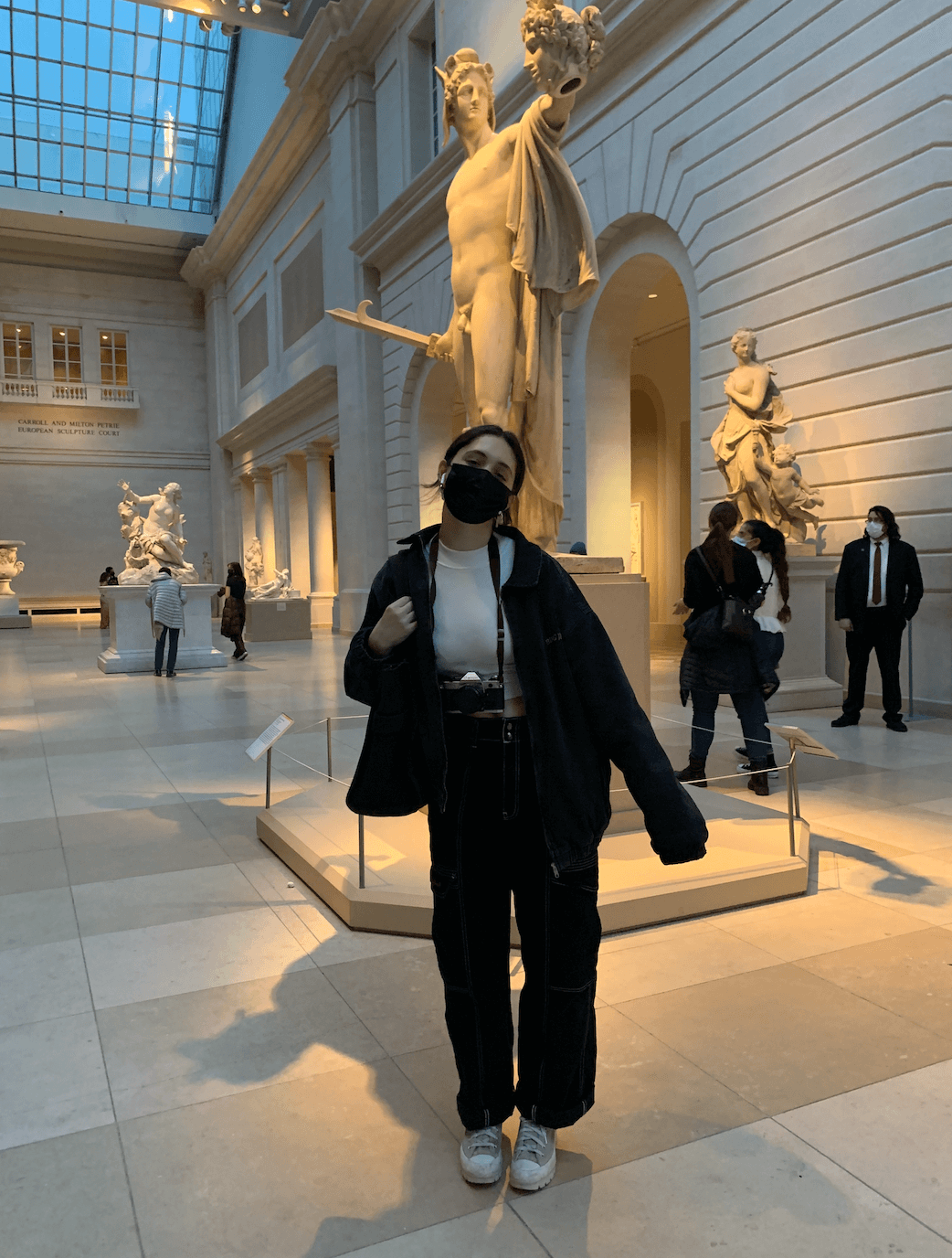 girl standing in a museum