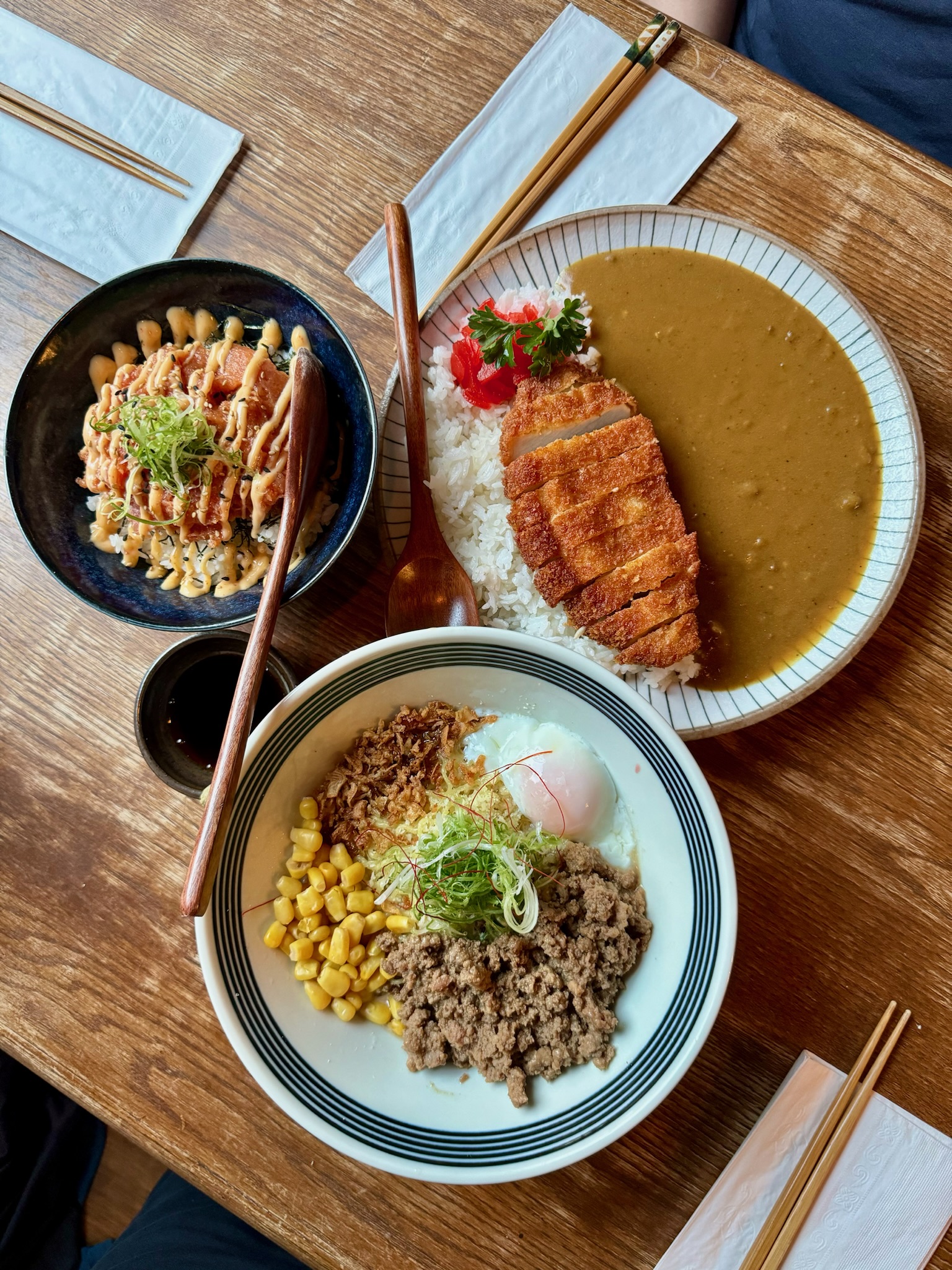 An overhead shot of three Japanese dishes