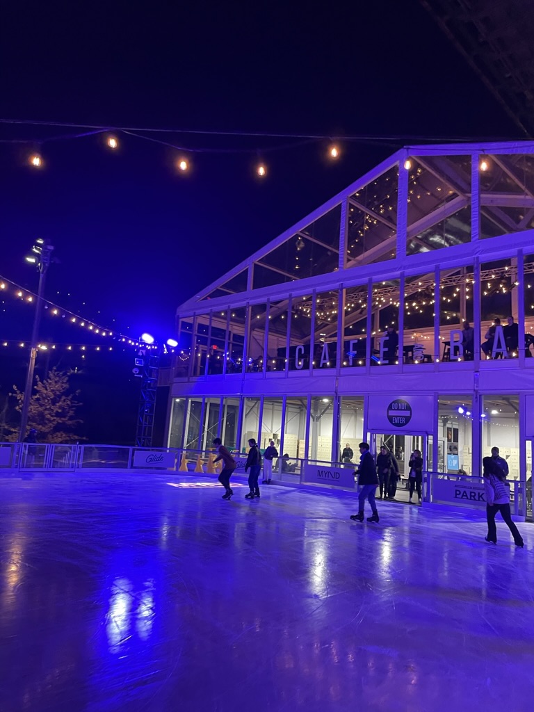 The Glide ice skating rink under the Brooklyn Bridge