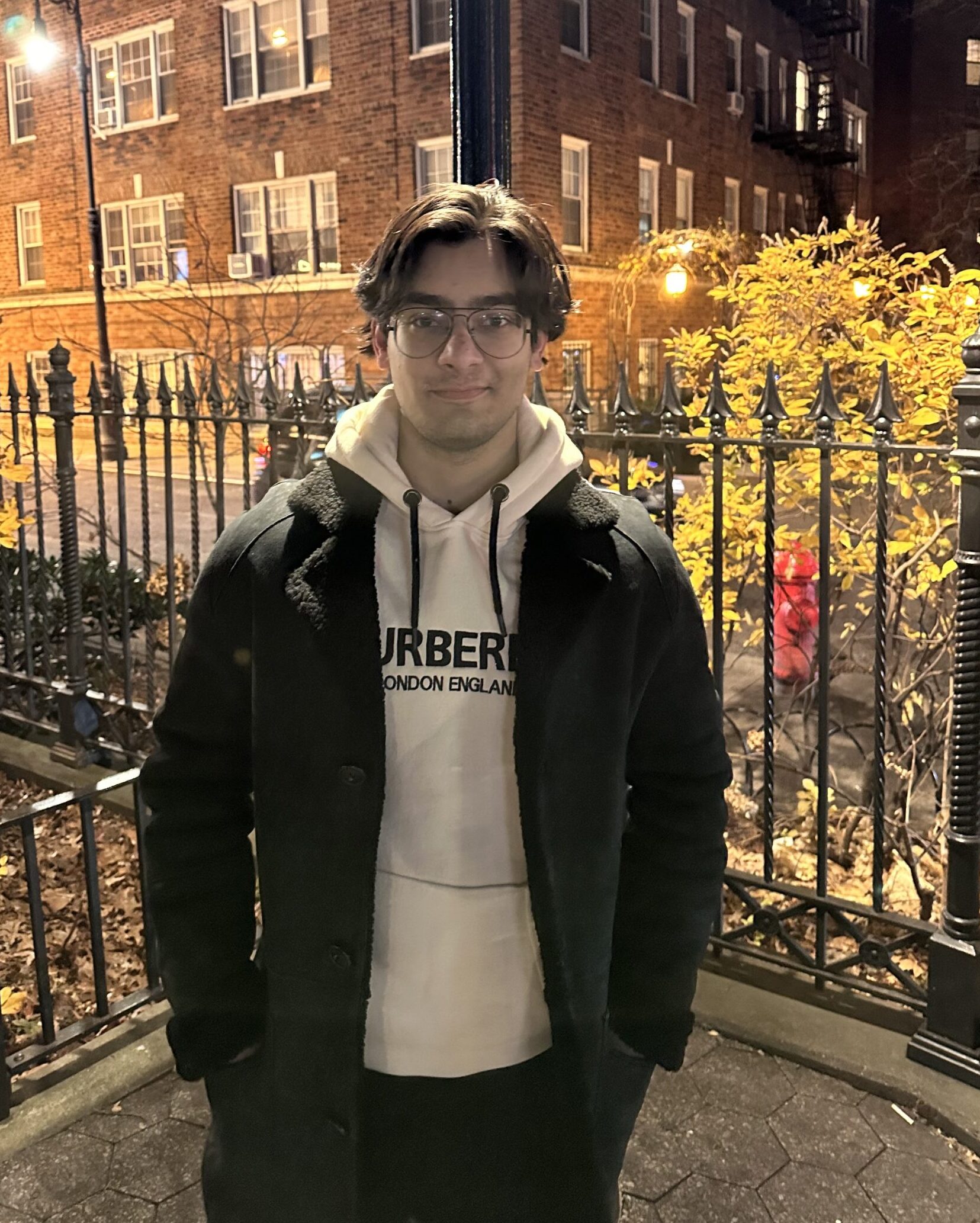 Umer Ali headshot outside of an NYU building