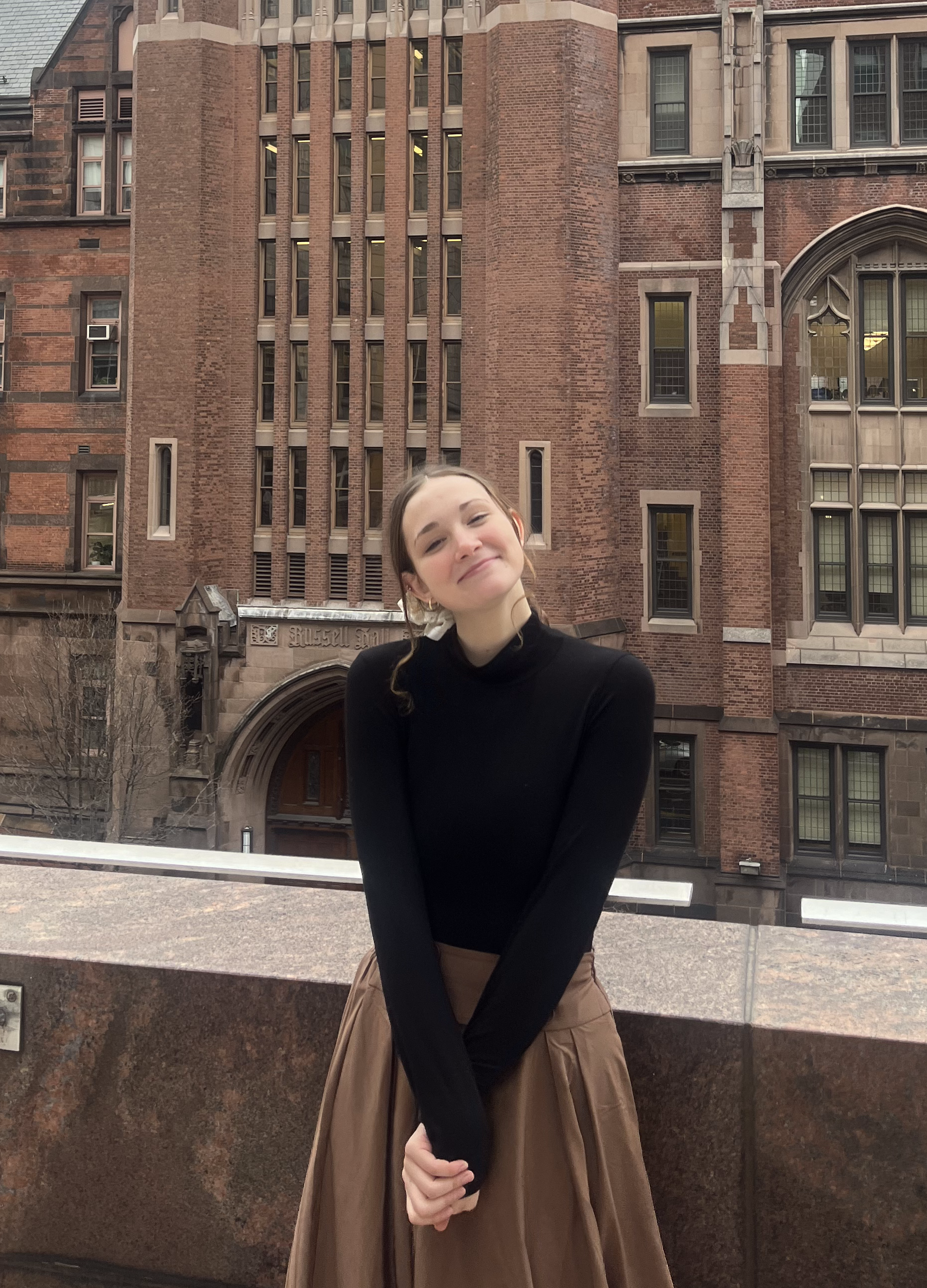 Laney Hawkins headshot in front of an old European building