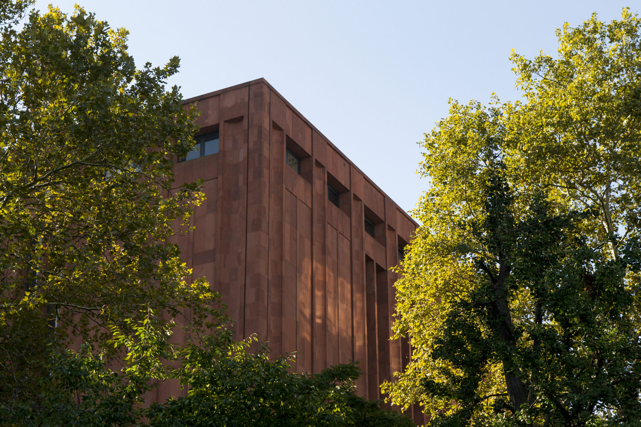 Exterior of the Bobst Library surrounded by trees.