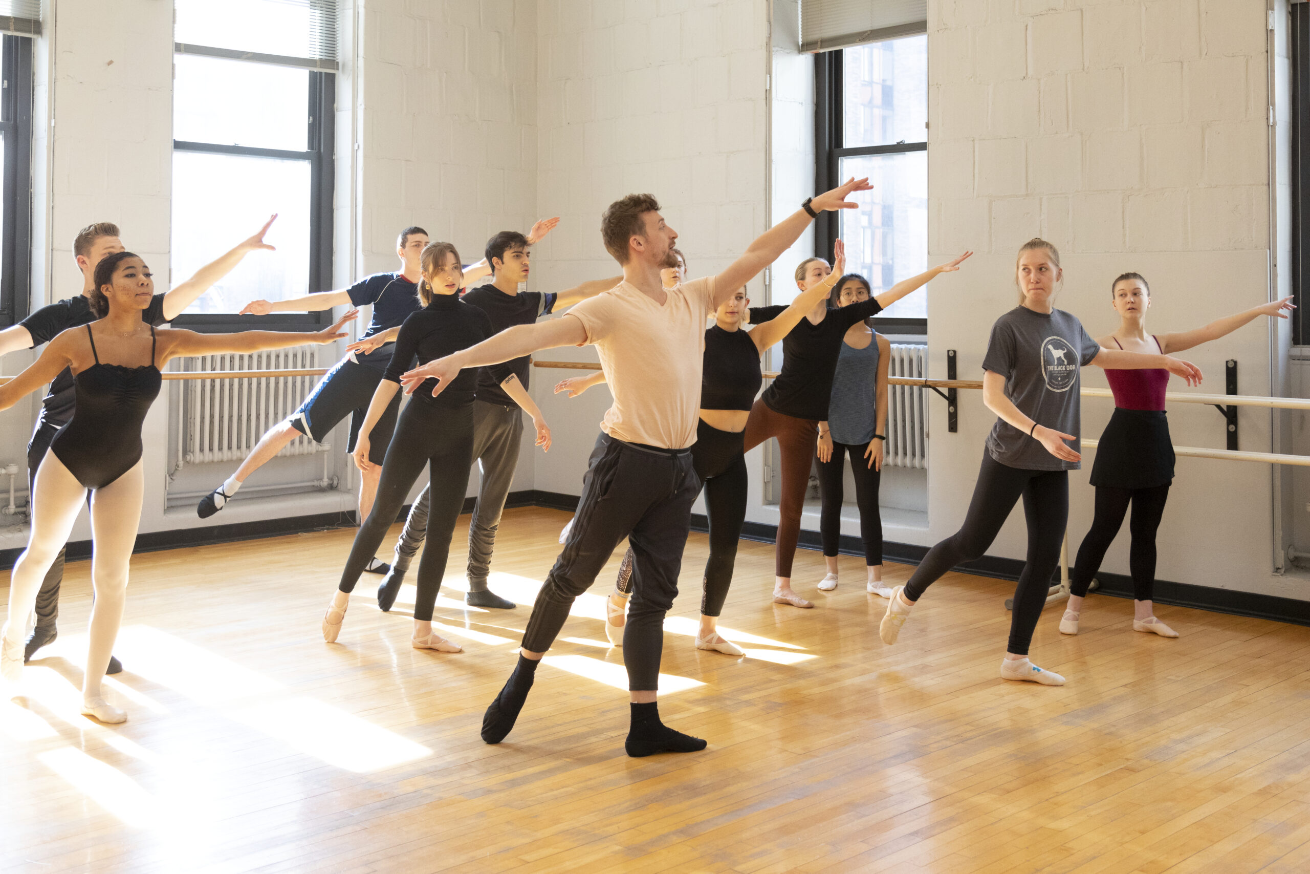 A professor leading a dance class