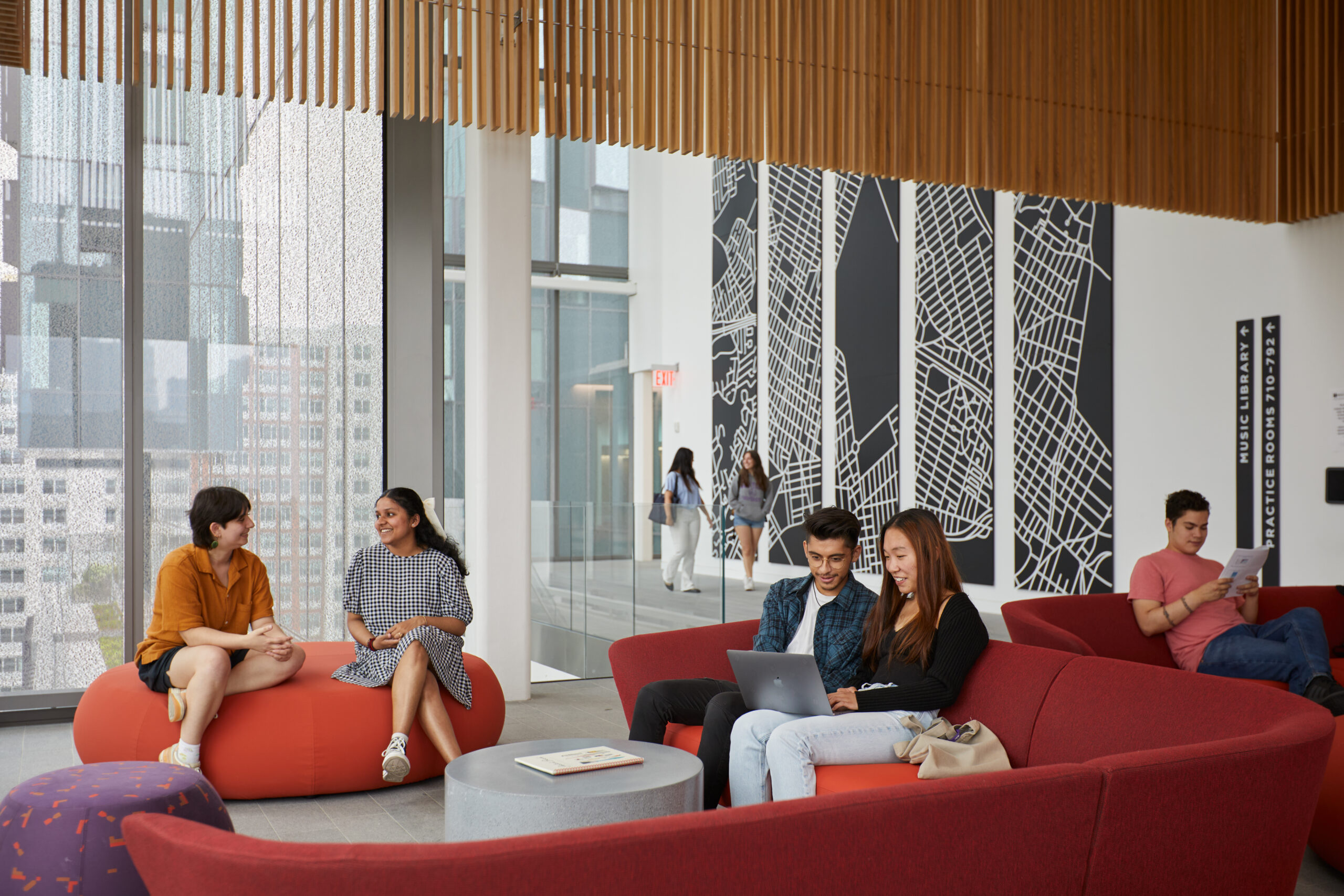 Students study on comfortable sofas and chairs in the Paulson Center.