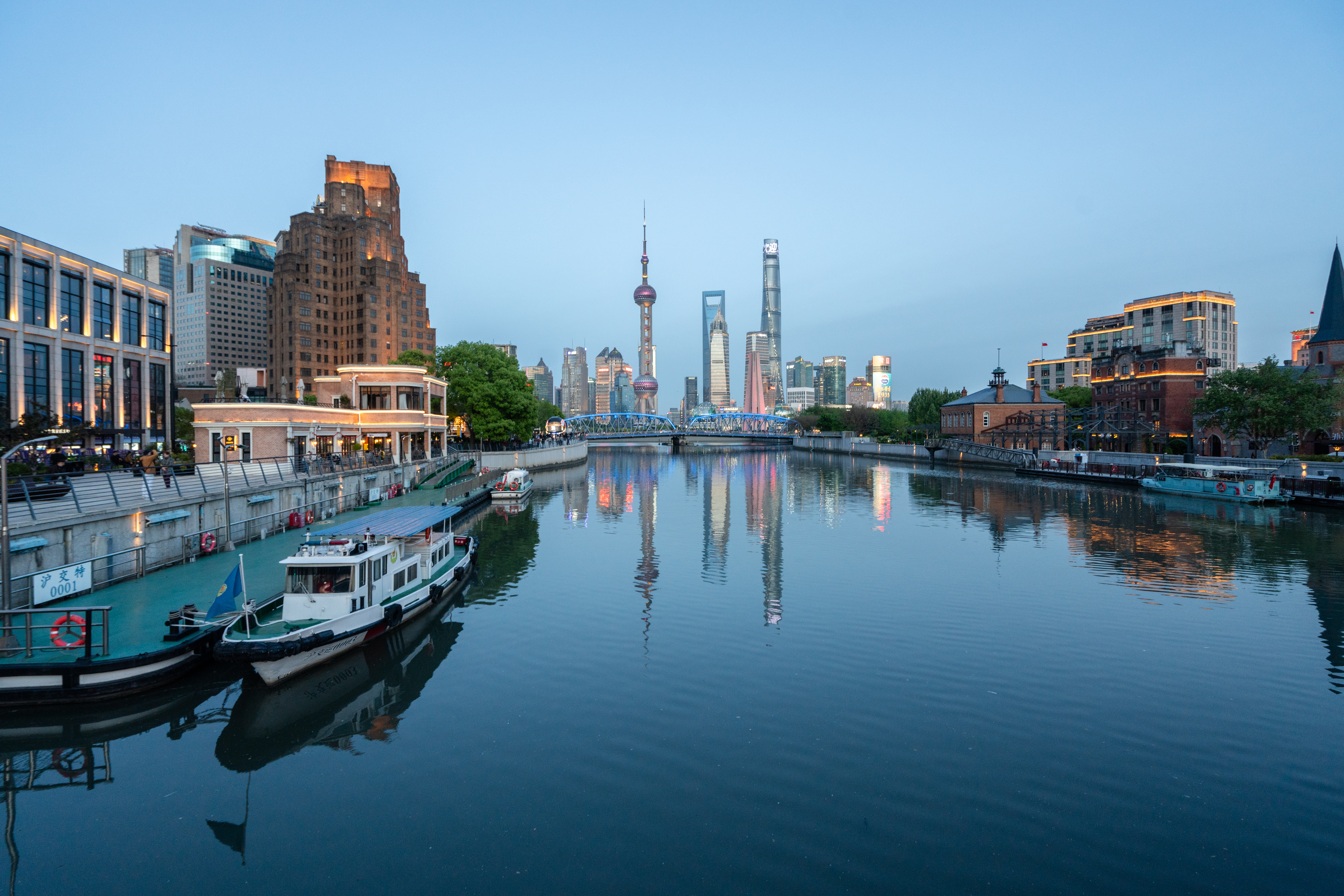 Skyline of Shanghai reflected in the river.