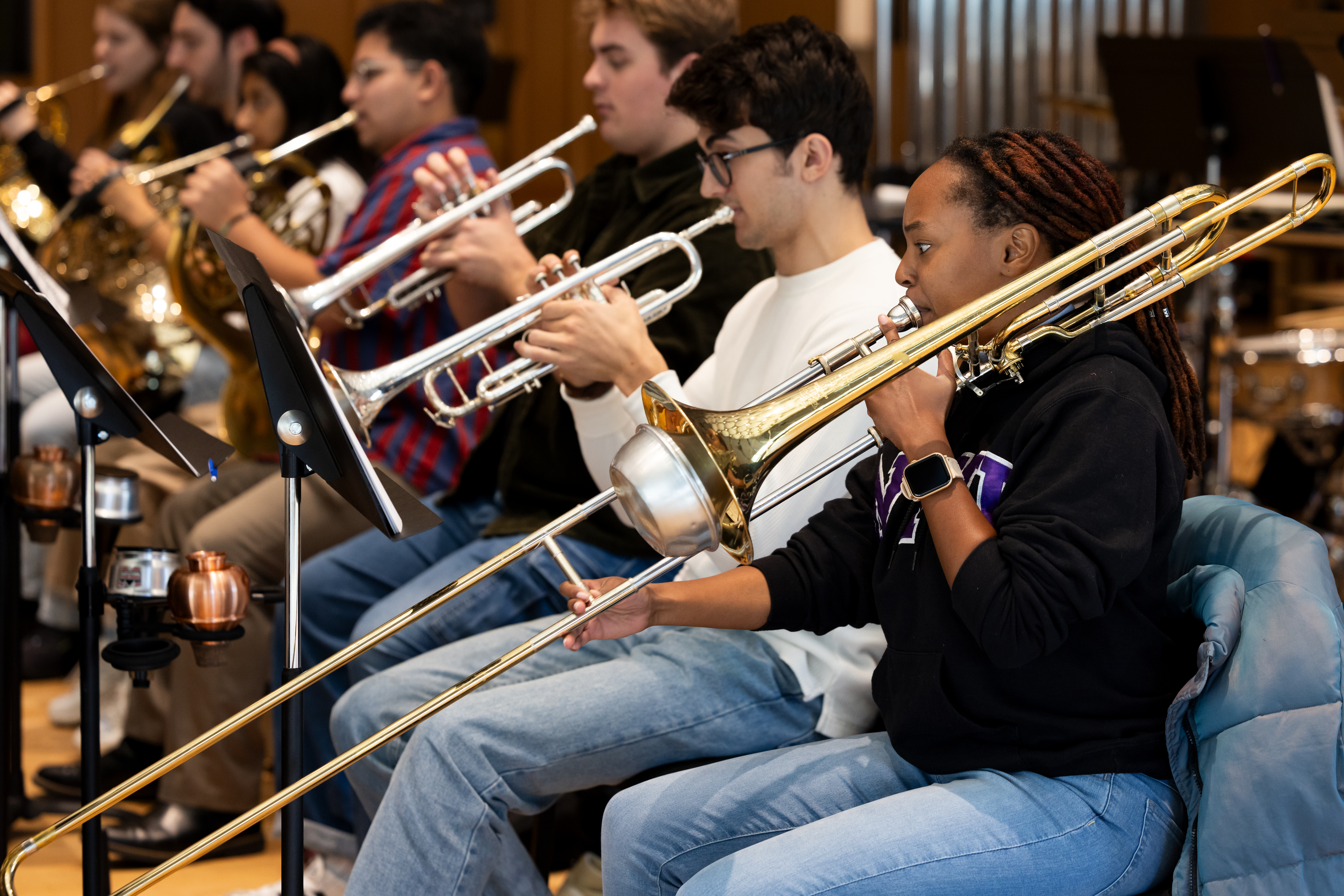 A group of students playing brass instruments