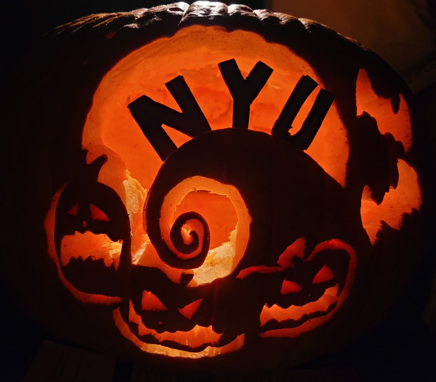 Carved pumpkin with the letters 