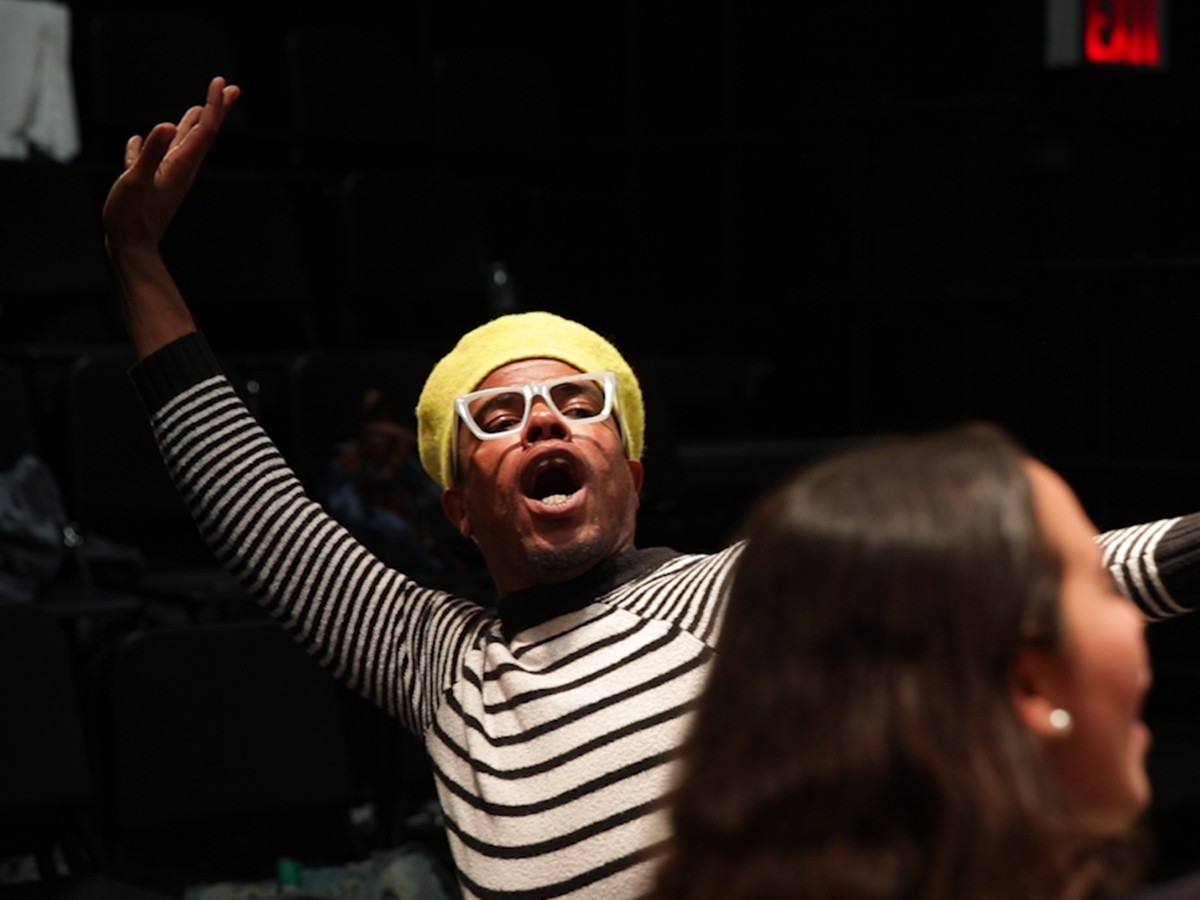 Teaching assistant Jordan Stewart performing during class
