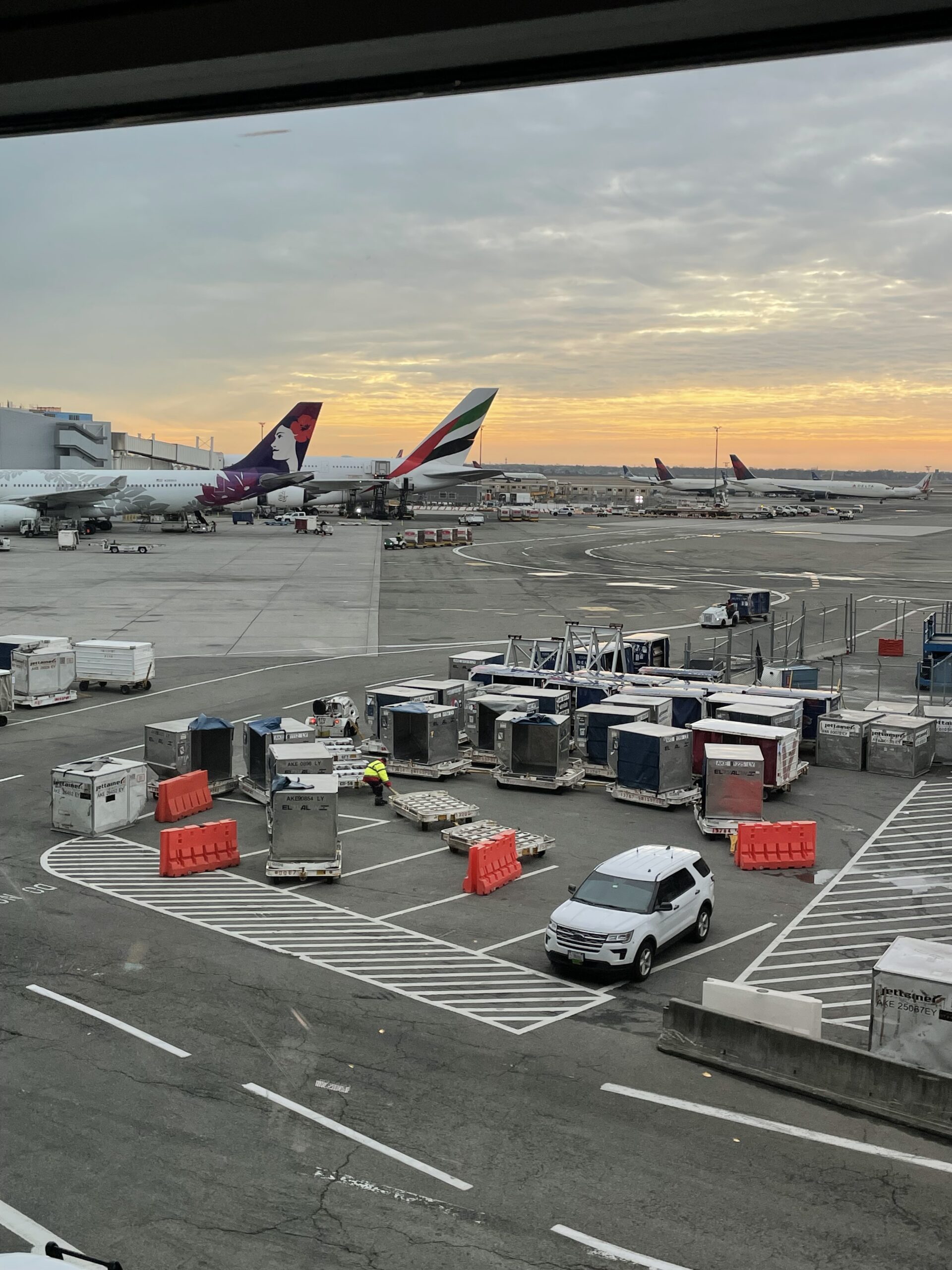 image of an airport with planes in the foreground
