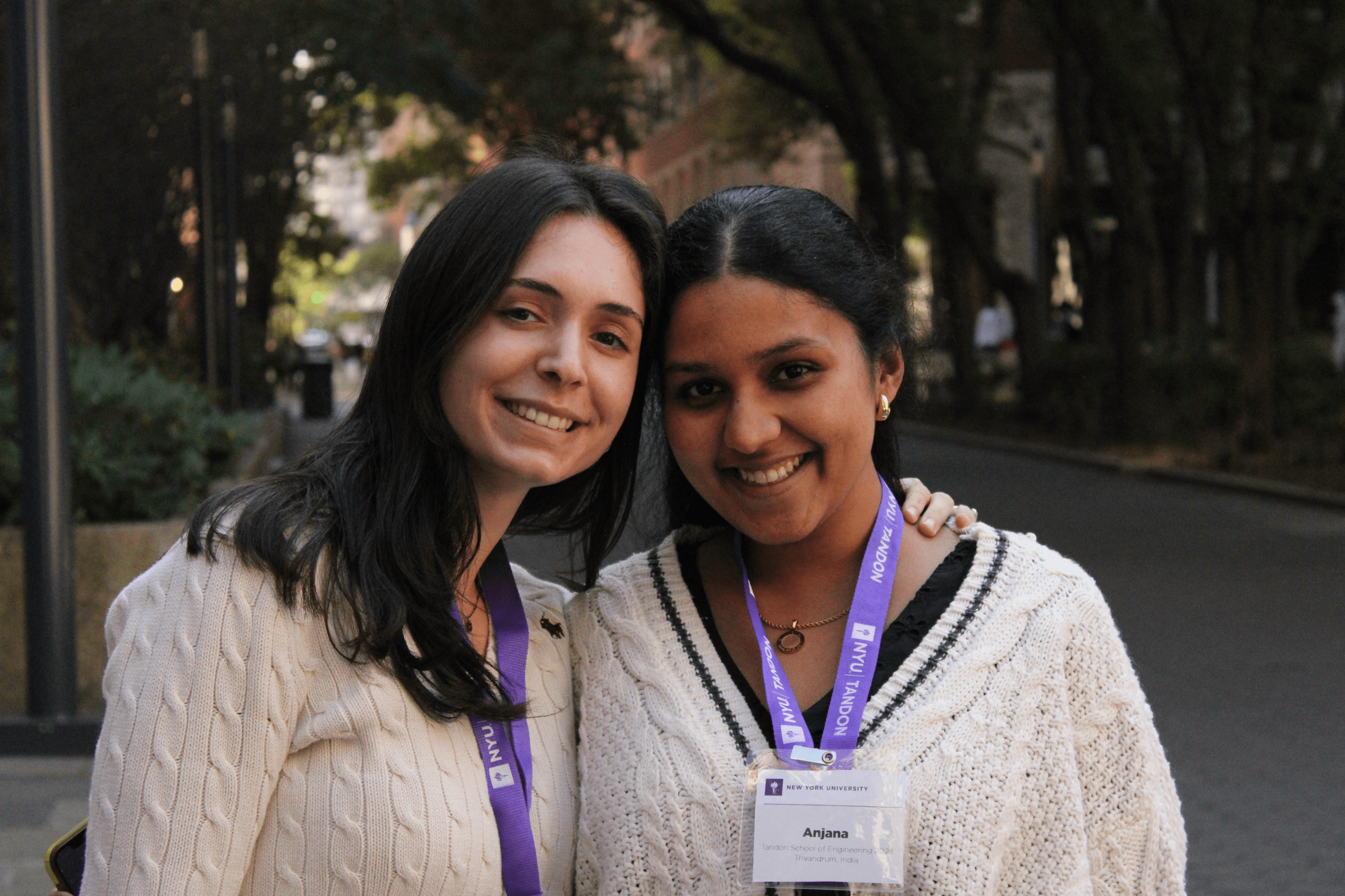 two girls at NYU smiling