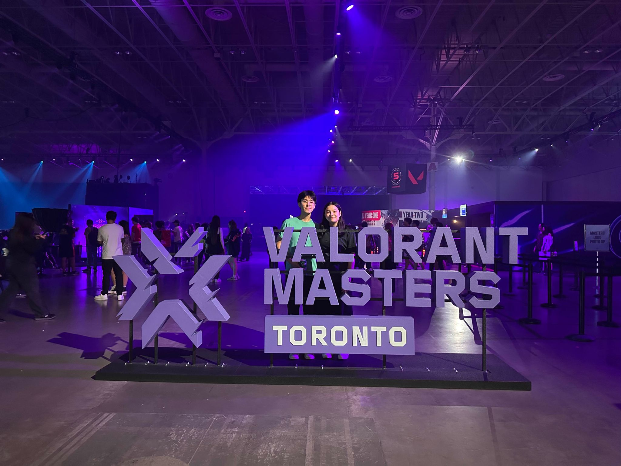 Jennifer Solomon stands behind a sign that reads 
