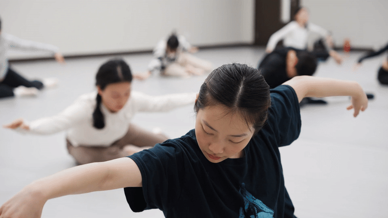Students dance in an NYUSH dance class