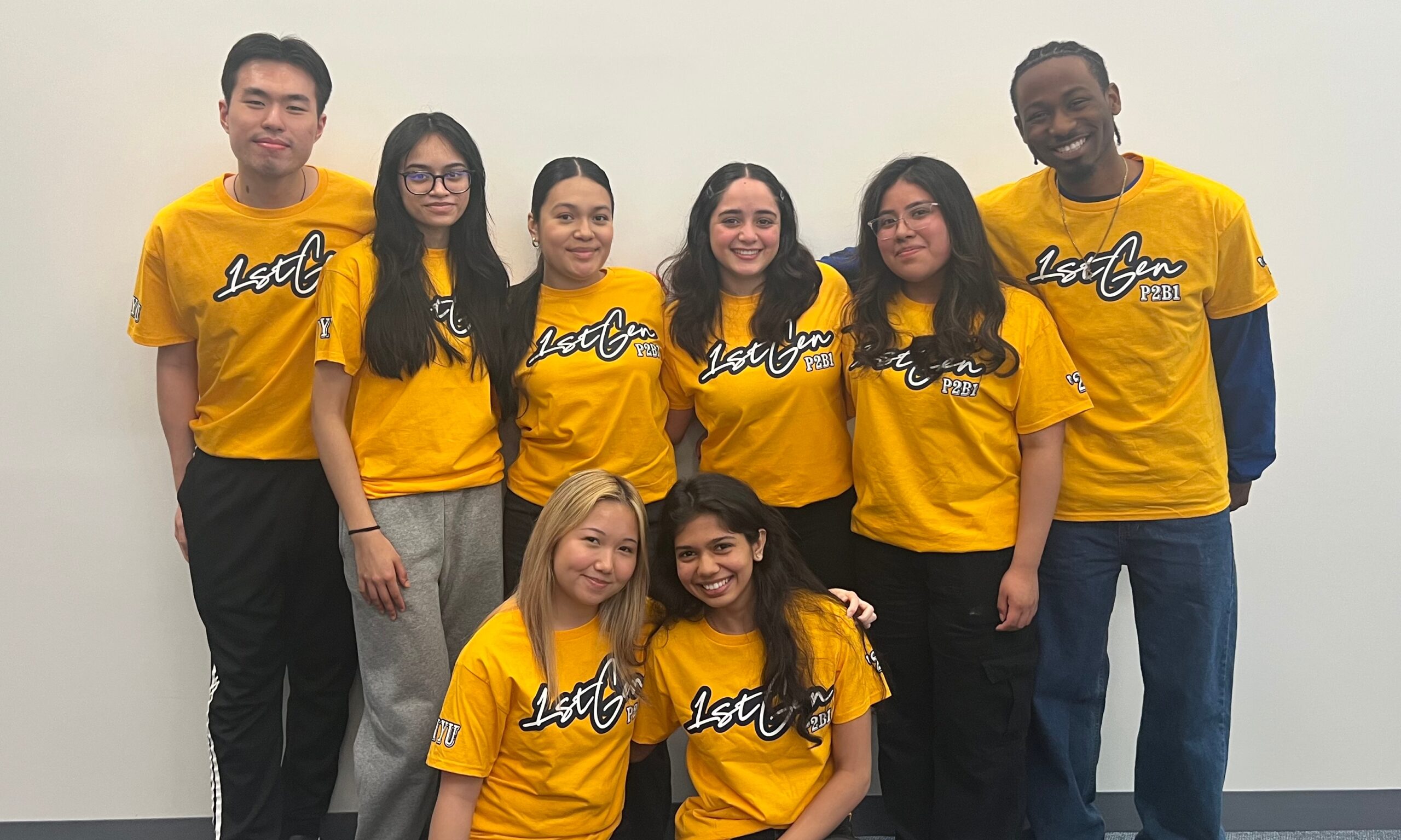 A group of students wearing yellow shirts that read “1st Gen P2B1.”