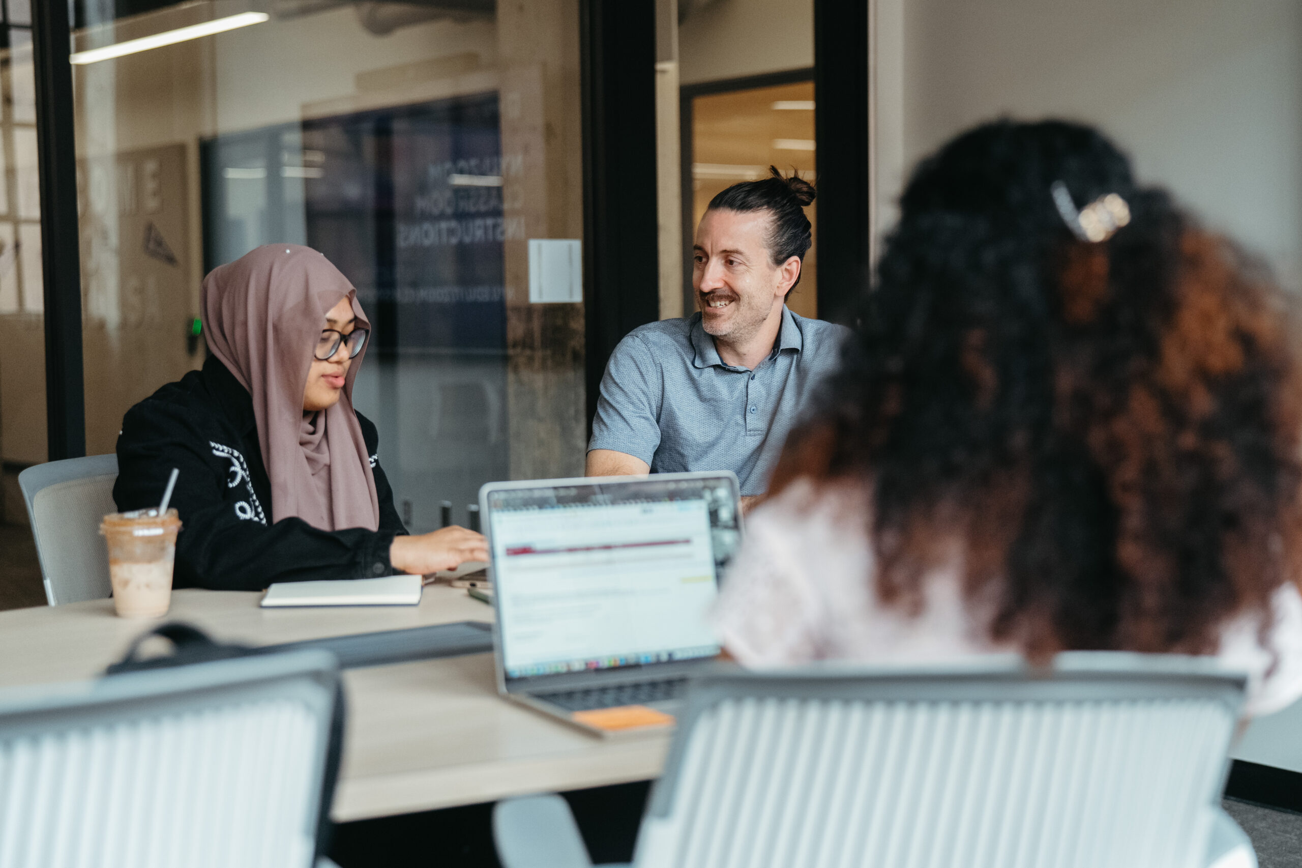 Students and a mentor speaking.