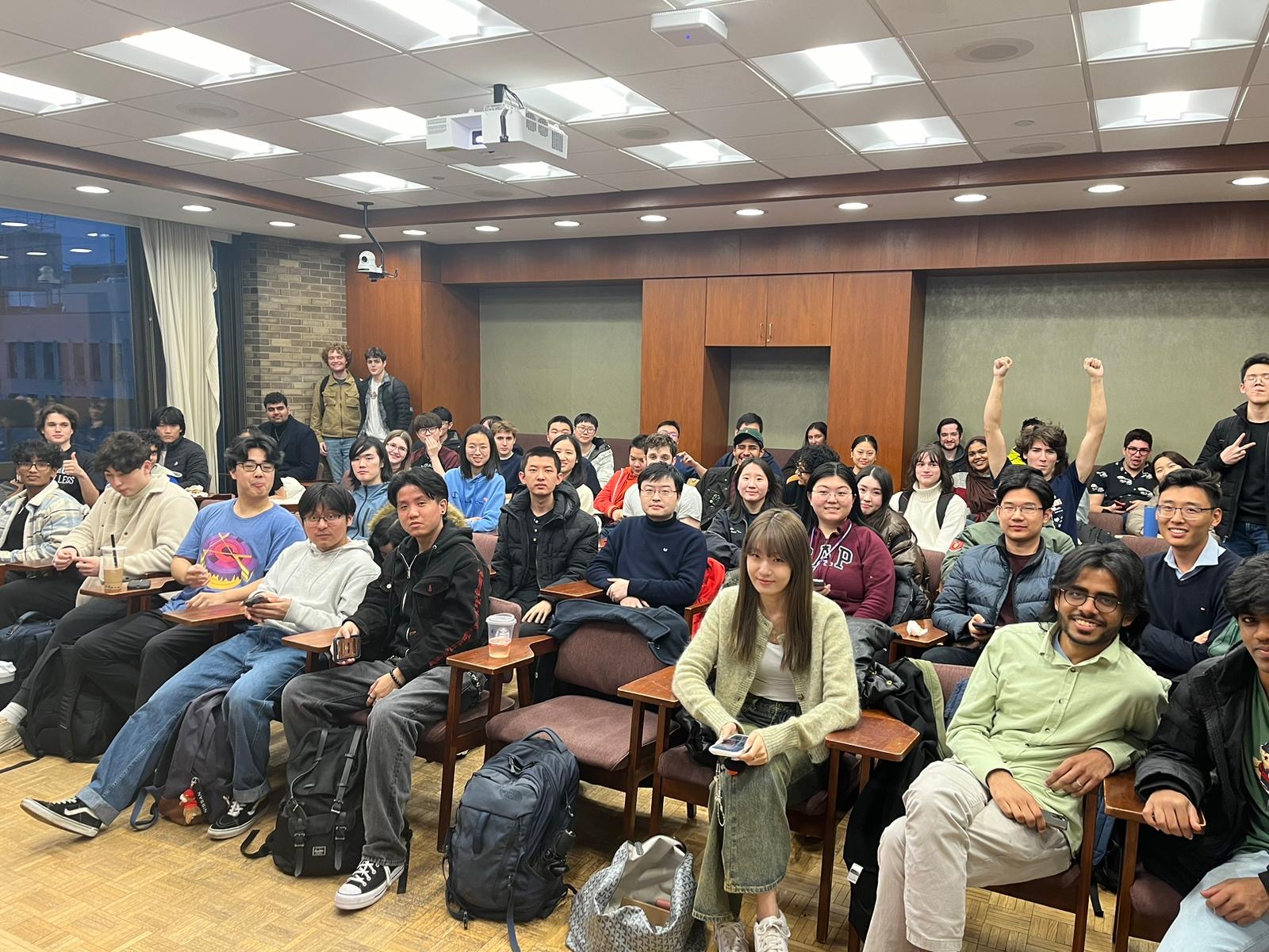 A large group of students seated in a classroom