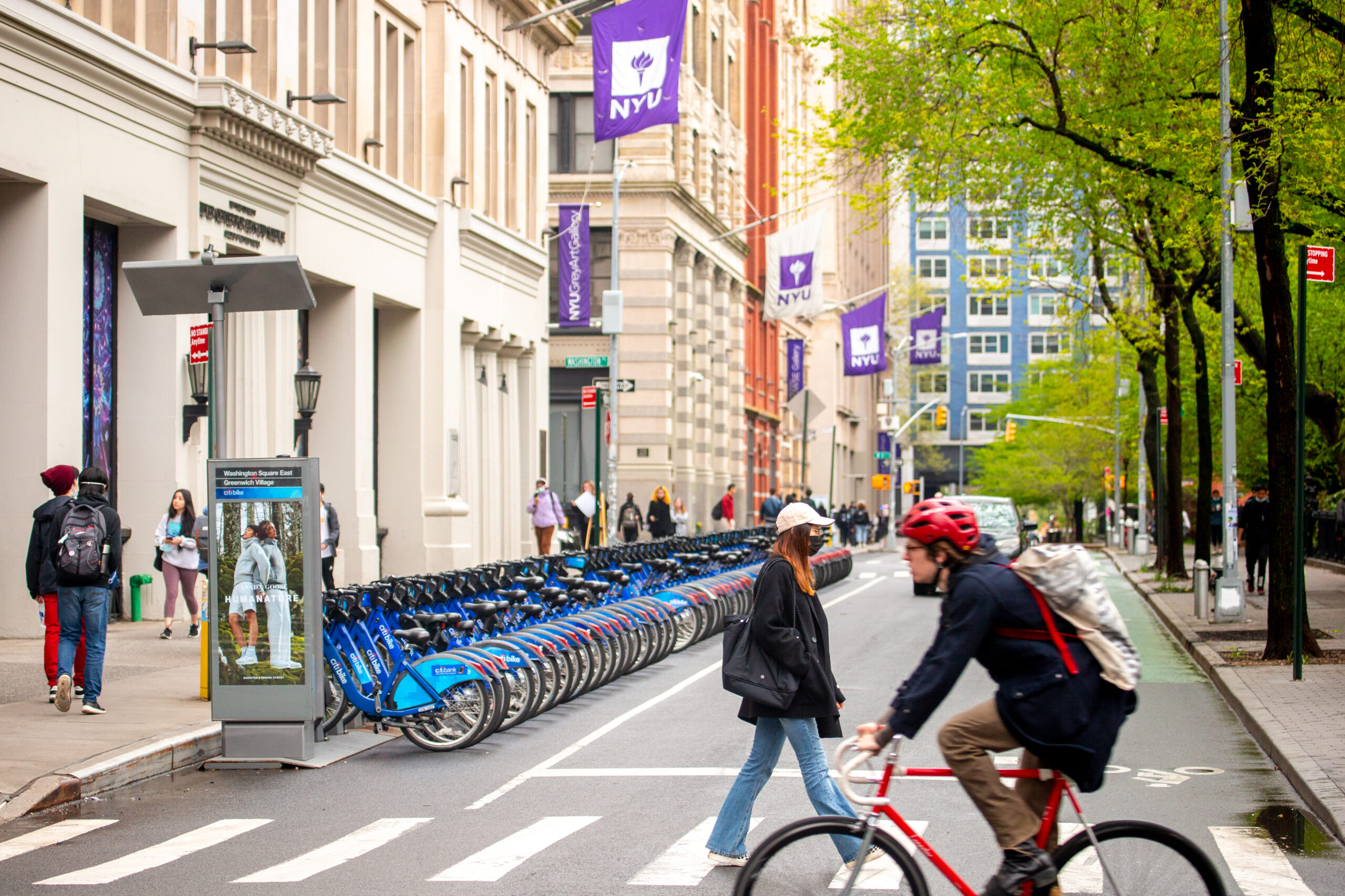Students biking and walking around campus.