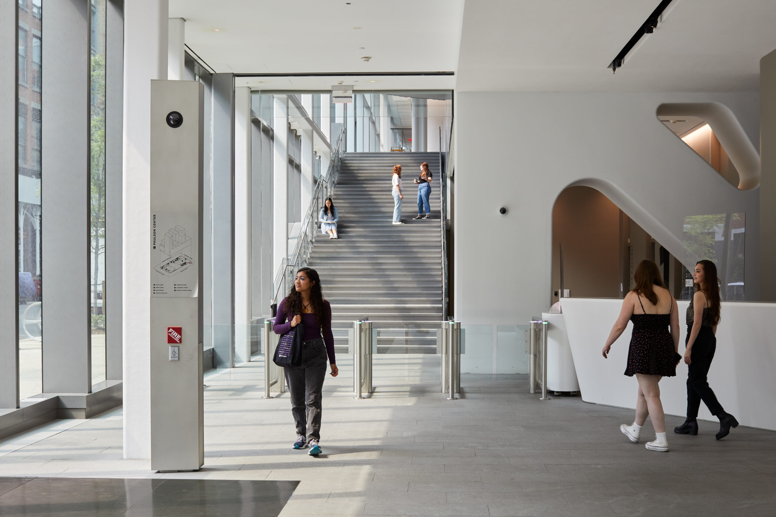 Students walking through the John A. Paulson Center.