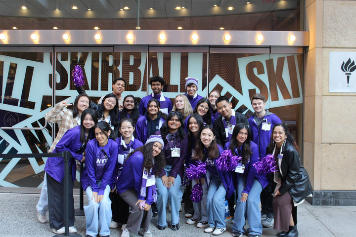 Admissions Ambassadors stand in front of Skirball Theatre