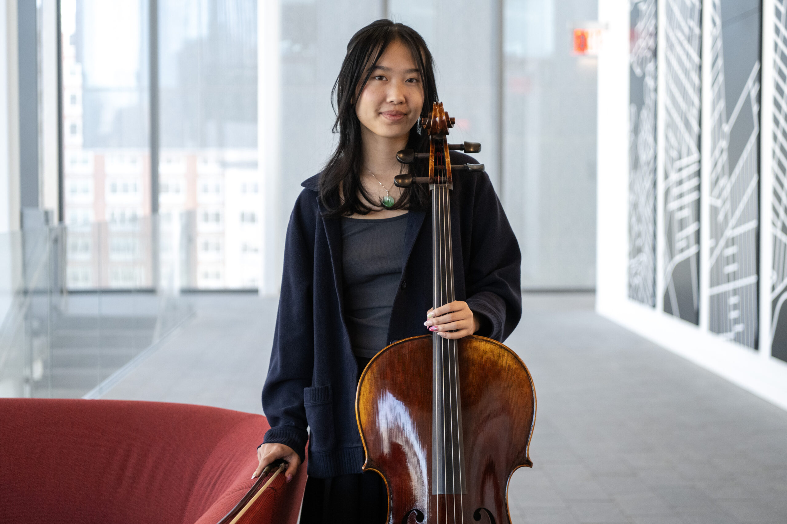 Grace Tan poses for a portrait with her cello at the John A. Paulson Center in New York.