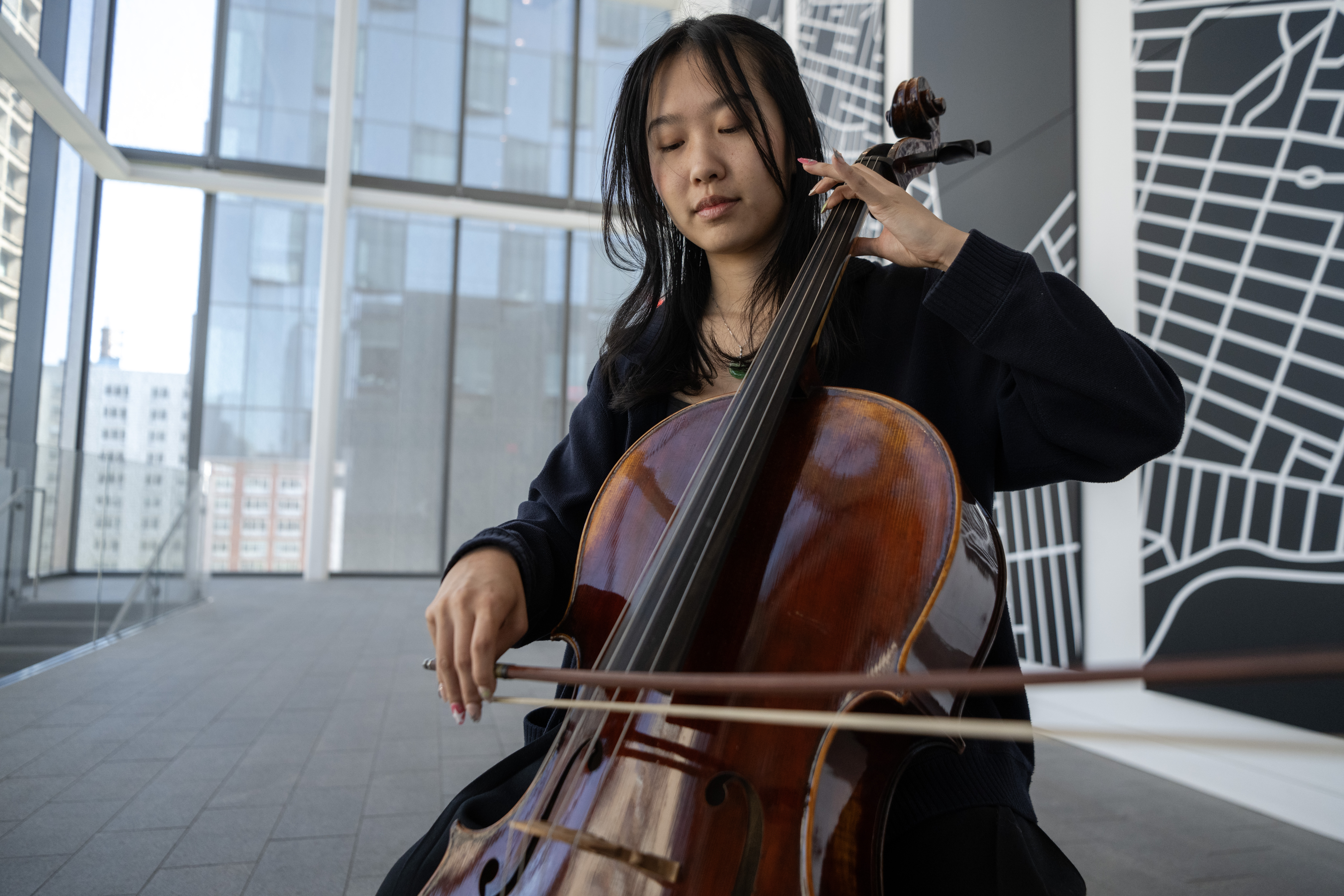 Grace Tan poses for a portrait with her cello at the John A. Paulson Center in New York.