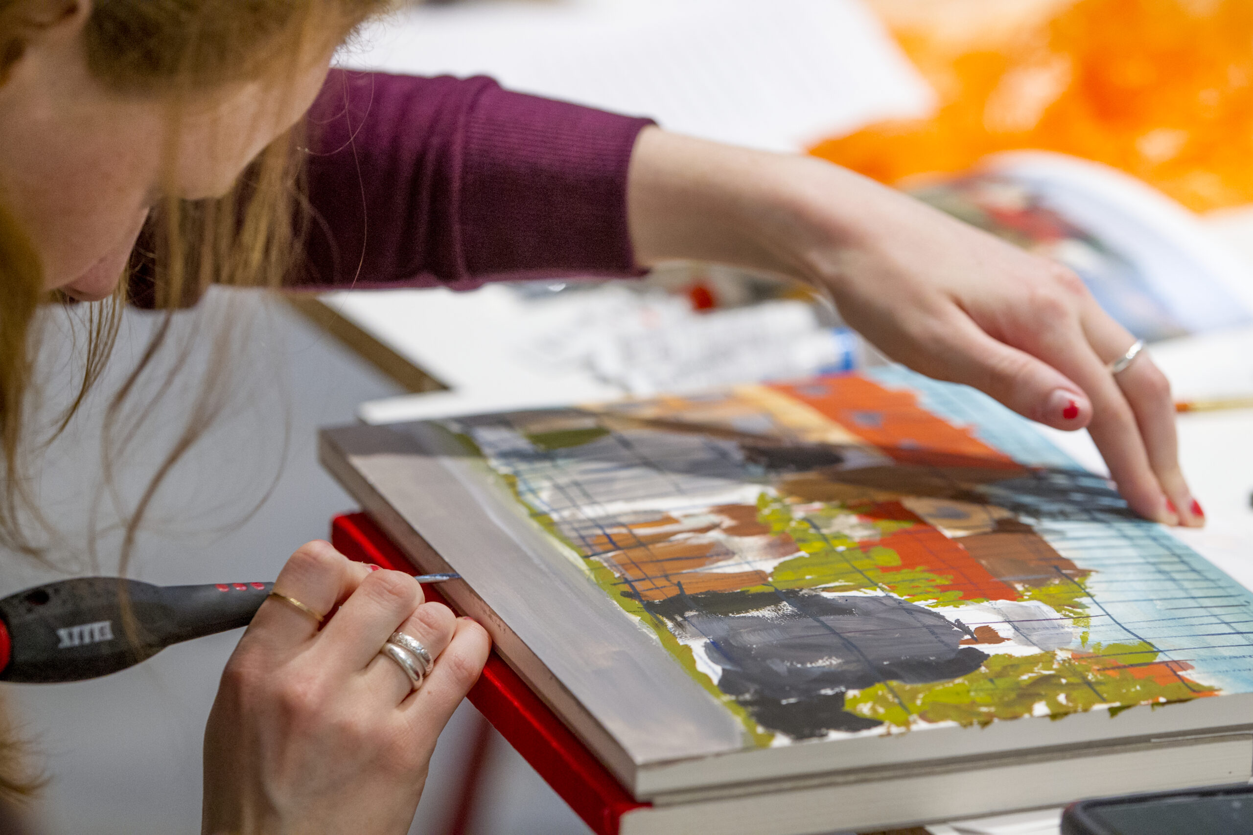 A student working on a painting.