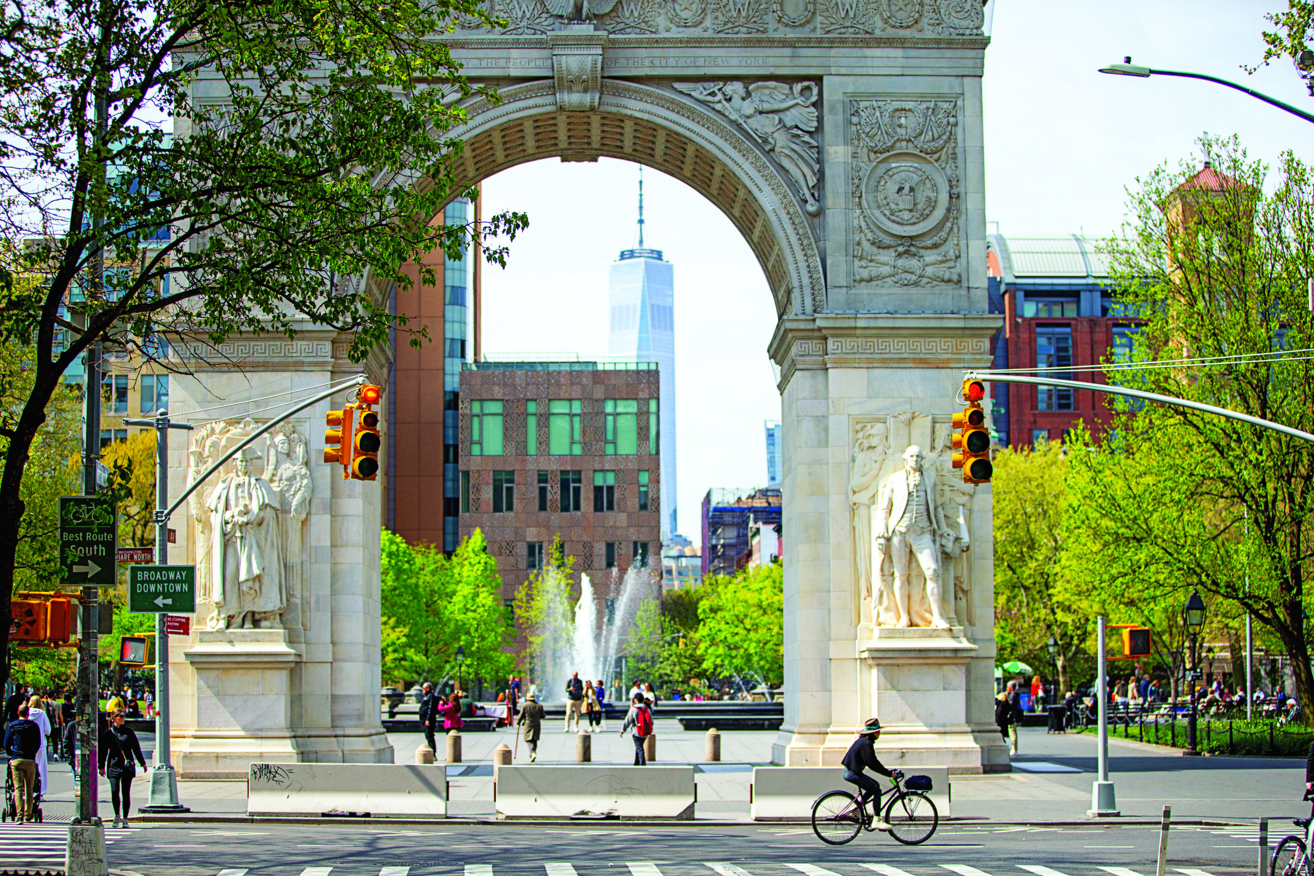 A busy street next to Washington Square Park in NYC.