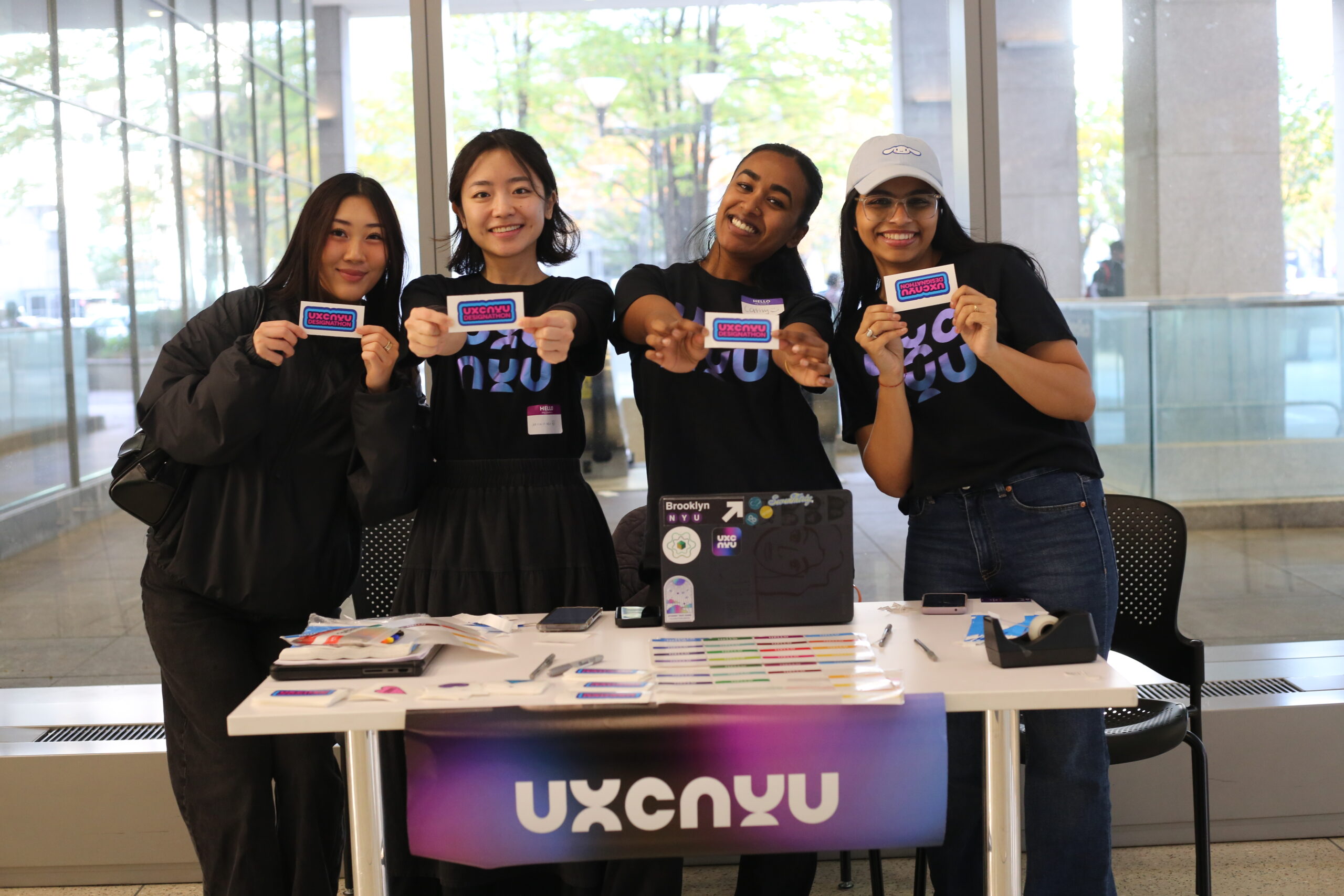 Members hold up stickers that read 