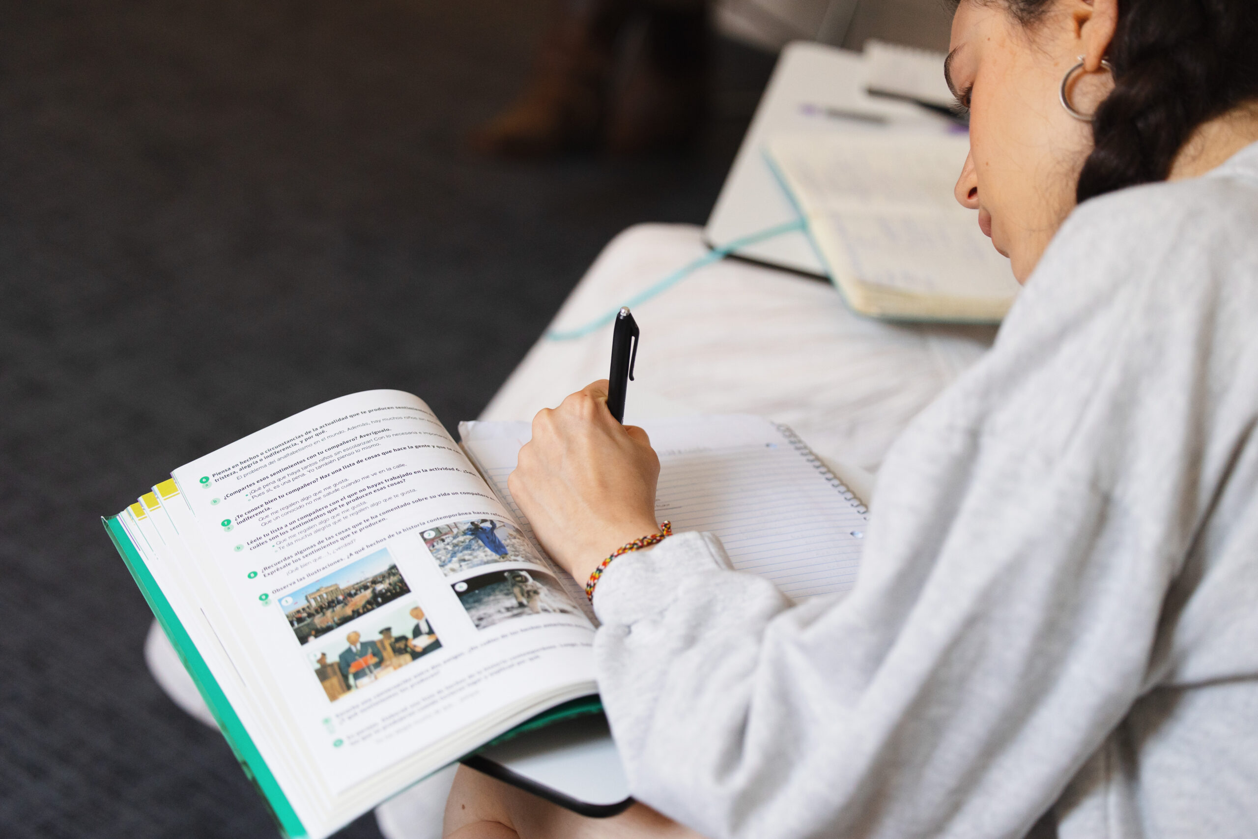 A student working in a language workbook.
