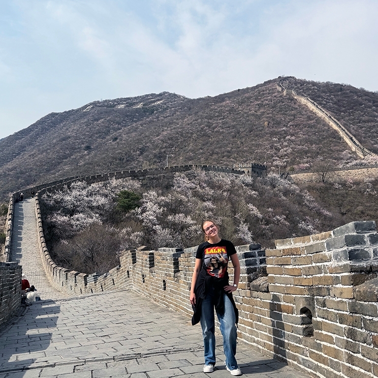 Student Anna Lipiec stands on the Great Wall of China.