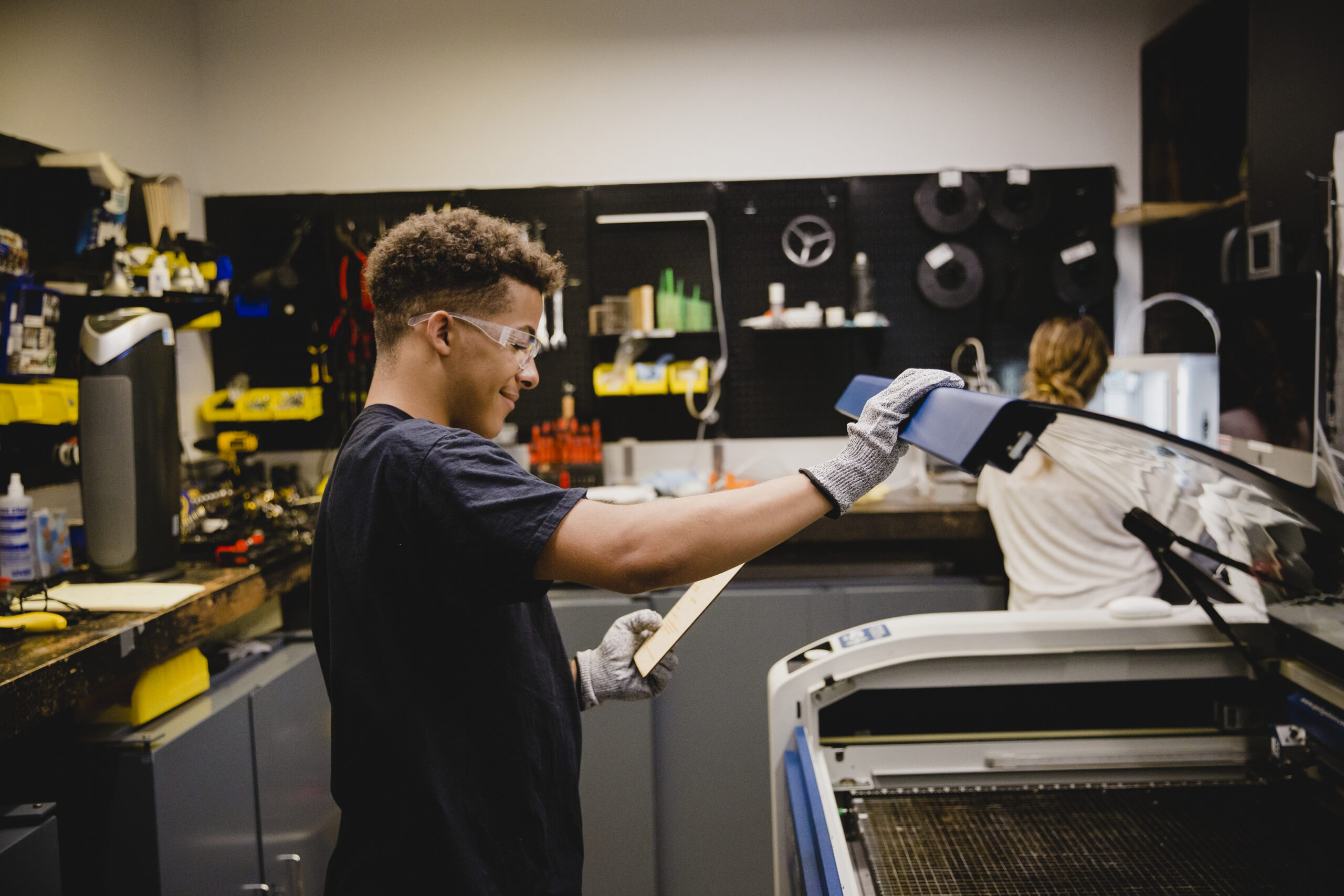 A student uses a printer in a lab.