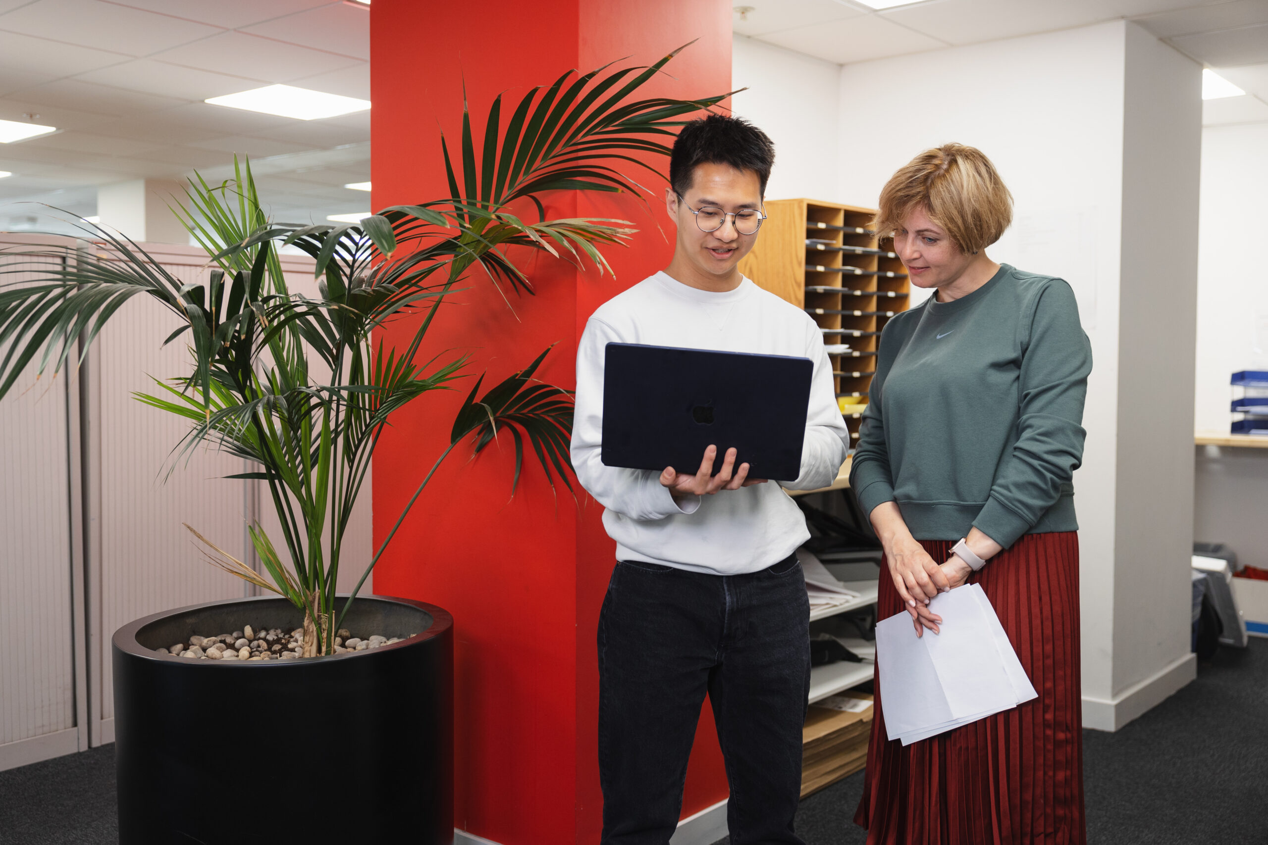 A student working with a colleague at an internship.