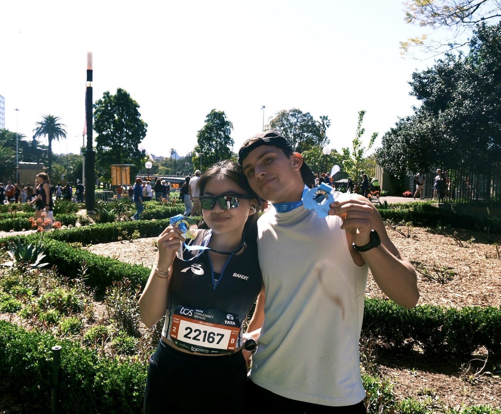 Amber and Henry holding up their metals from the race.
