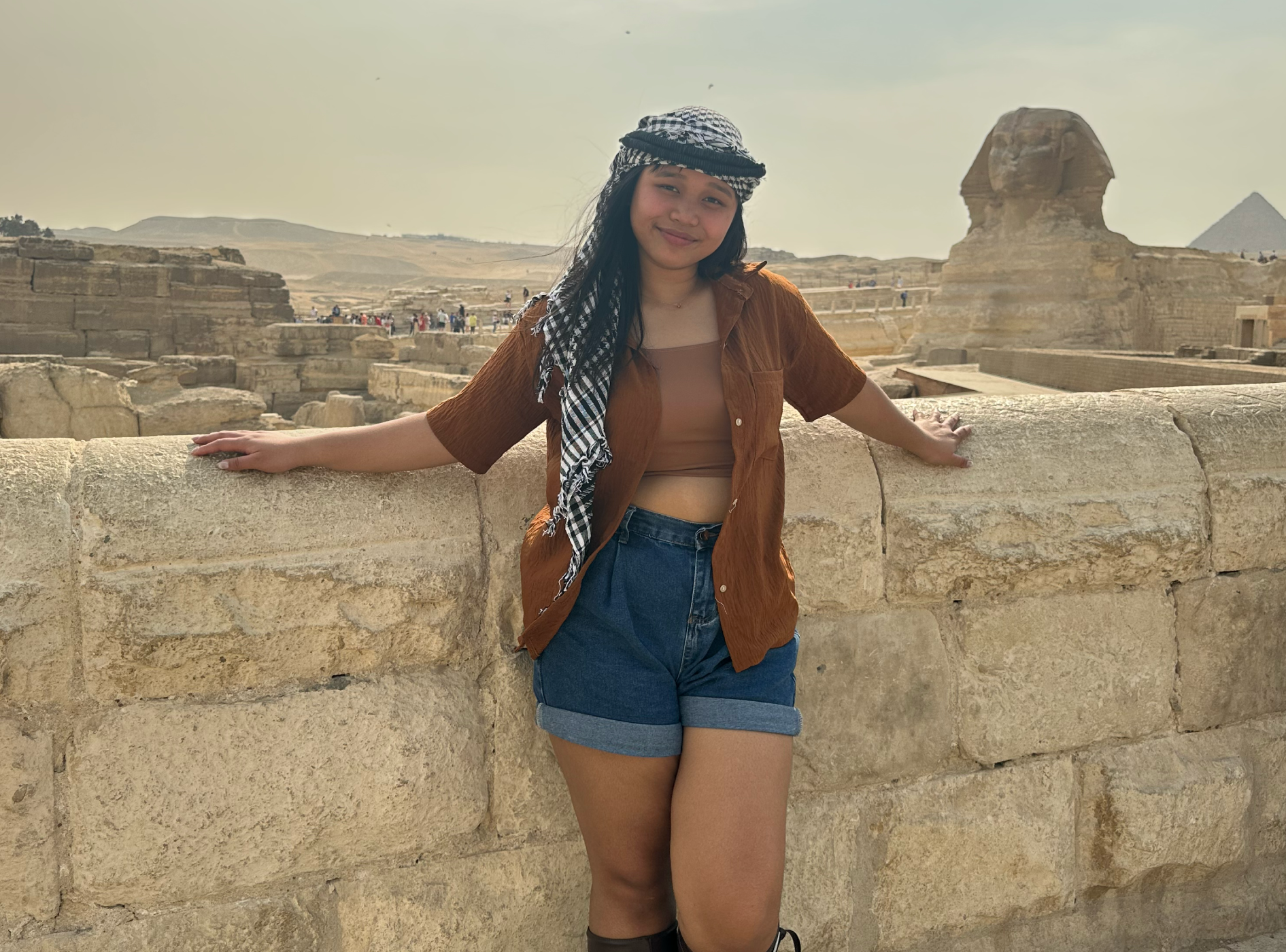 Brettany standing in front of pyramids in Egypt.