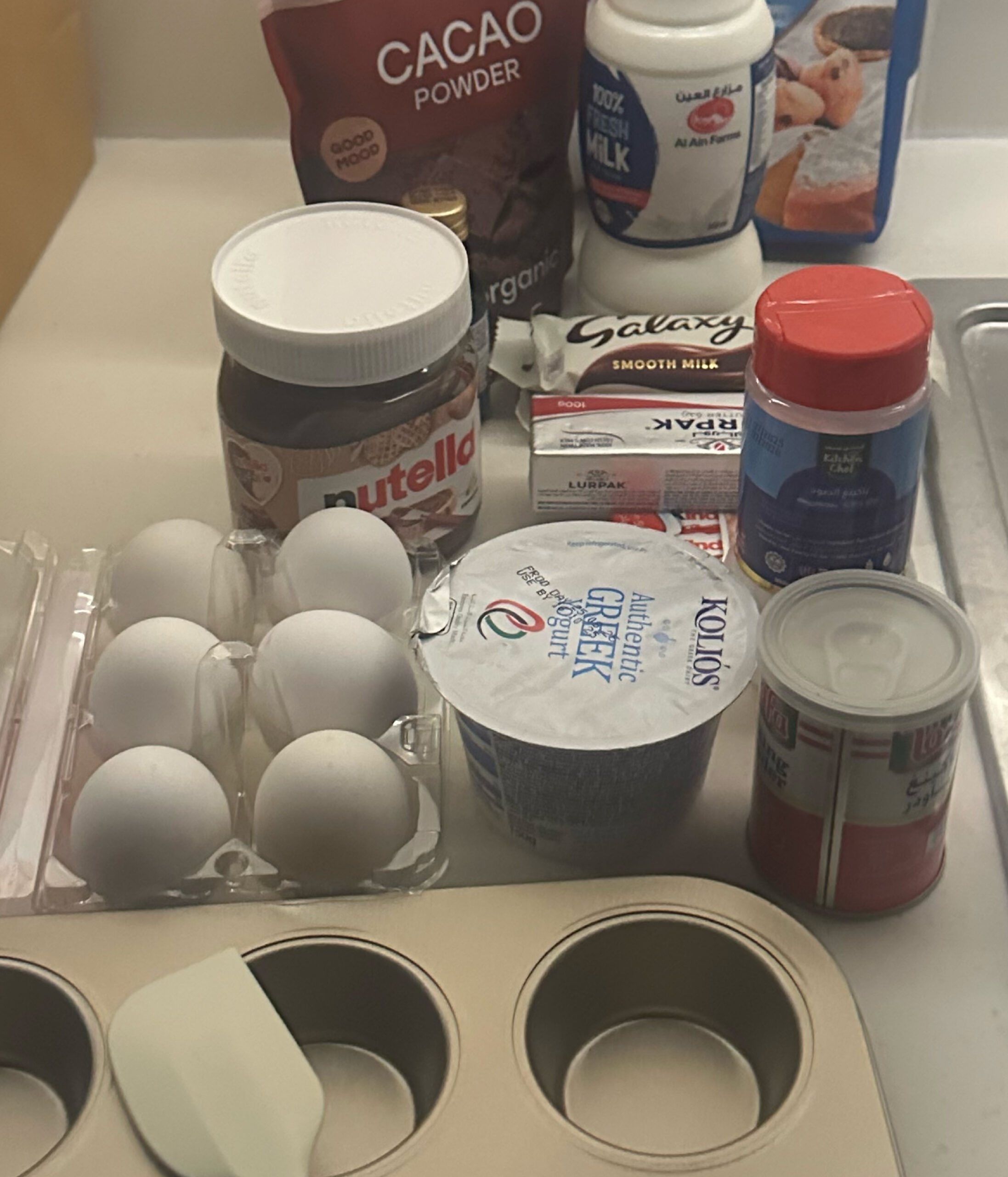 A tabletop full of baking equipment.