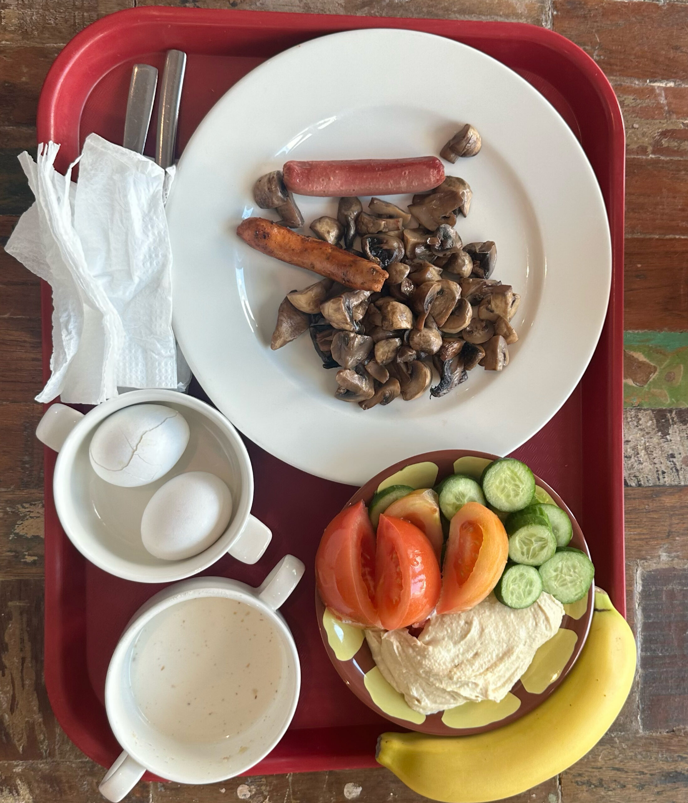 A full meal of hard boiled eggs, fruit, and hummus.