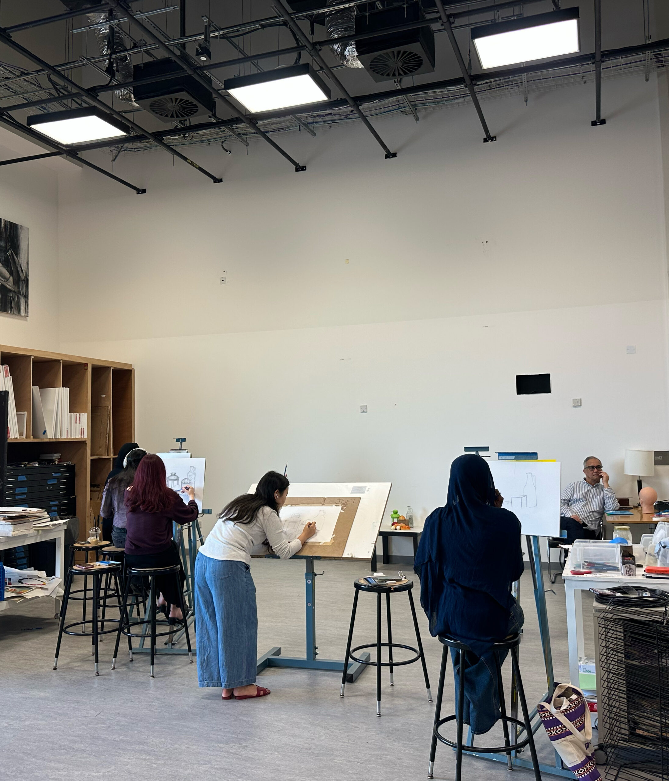 Students work in a painting class.