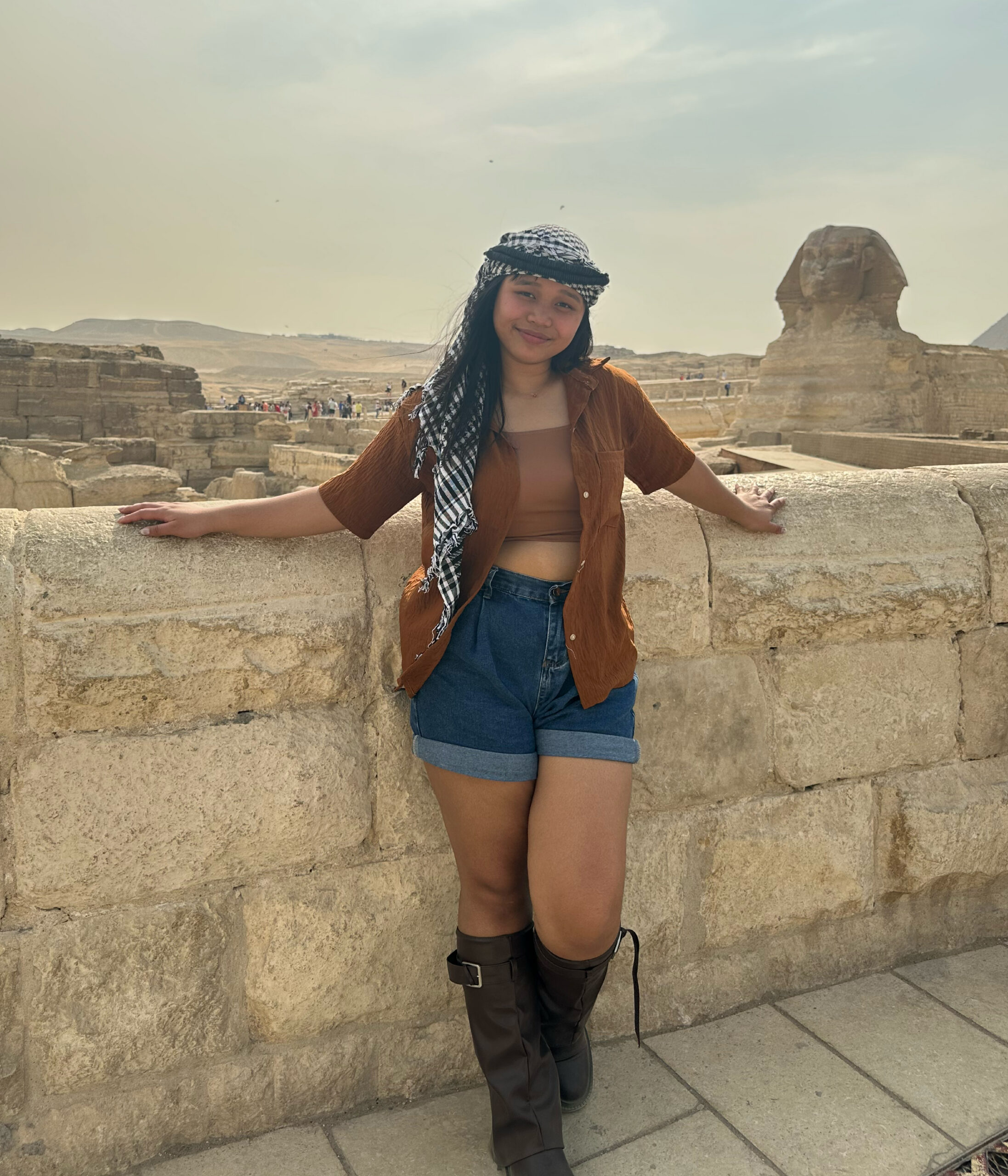 Brettany stands in front of pyramids in Egypt.