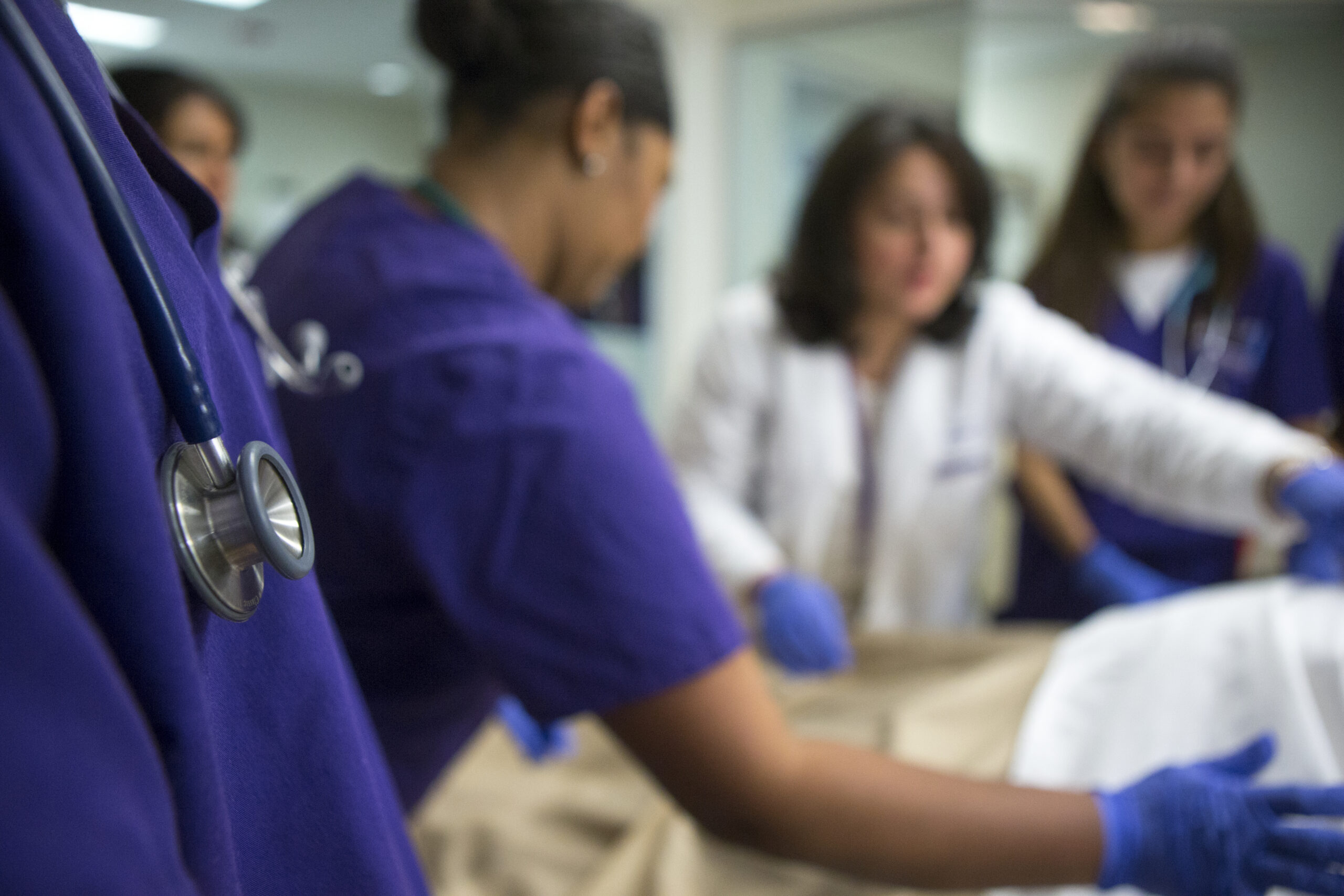 Students working in a nursing simulation lab.